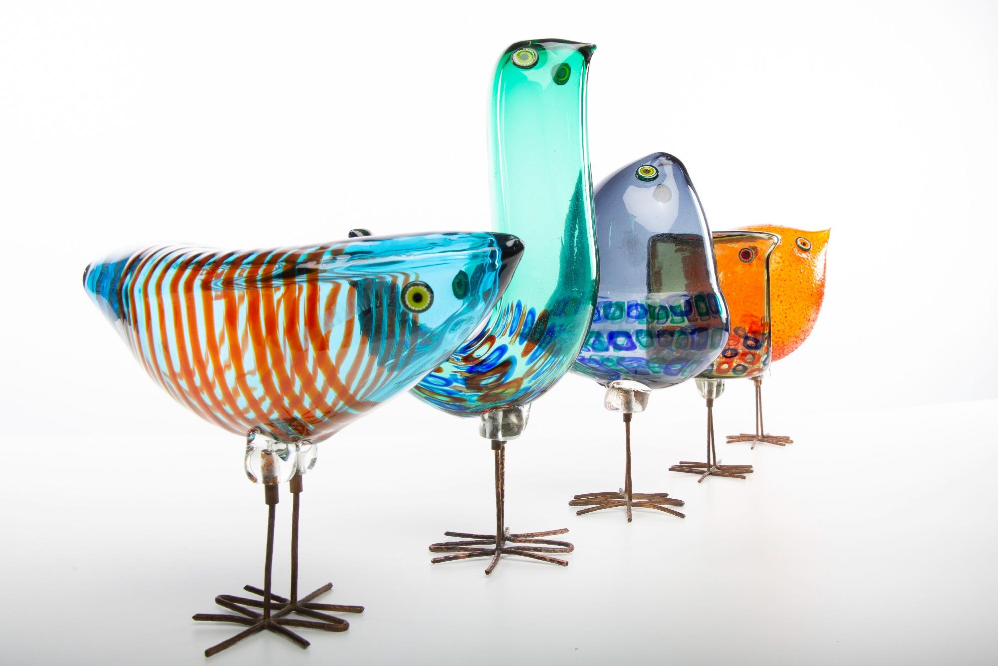 A rare collection of 5 birds designed by Alessandro Pianon for the Vistosi manufacture on the island of Murano (Italy) around 1962.

The orange bird is in textured blown glass, on copper legs, eyes in murrine.
The other birds are blown glass with