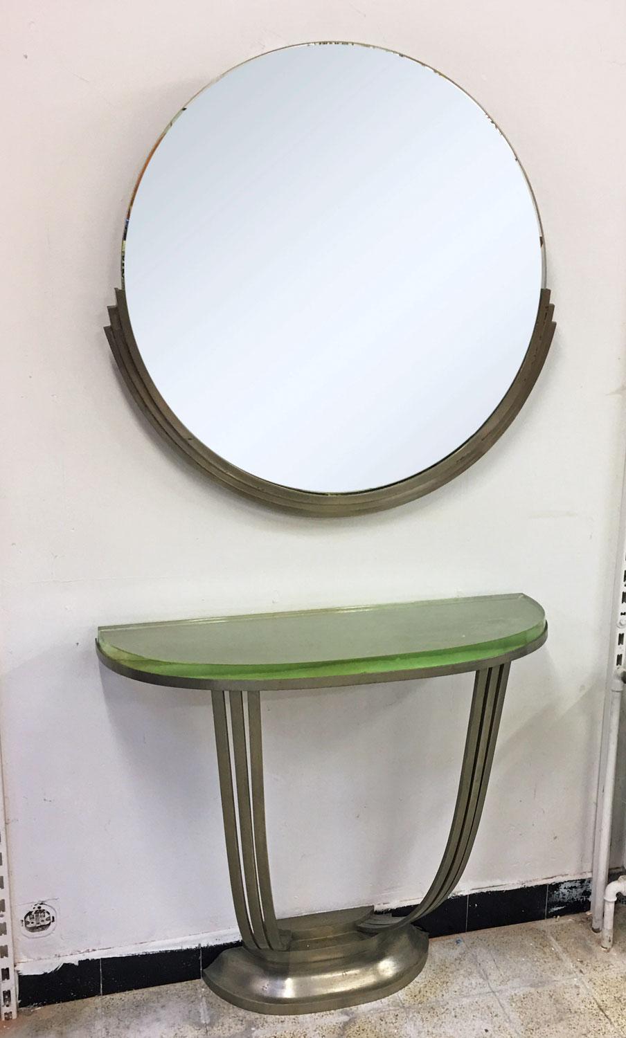 Rare console and its nickeled bronze mirror in the style of Jules Leleu, circa 1930
the glass which is 30mm thick has small flaws (chips) but below, very little visible when the glass is placed
Dimensions: console 84 x 89 x 38 cm
diameter mirror 85