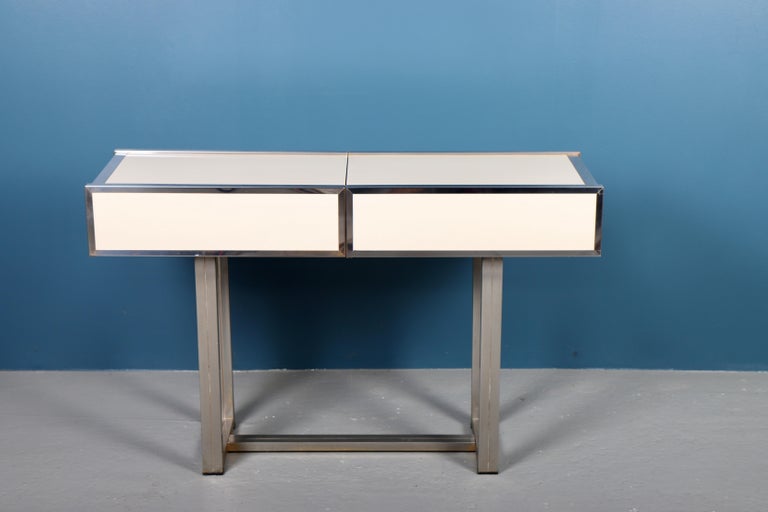 Rare console table of chromed brass and creme coloured laminate. Sliding top. Manufactured 1970s by Mario Sabot, Italy. Measures: H. 77 cm. W. 122 cm. D. 39 cm.
