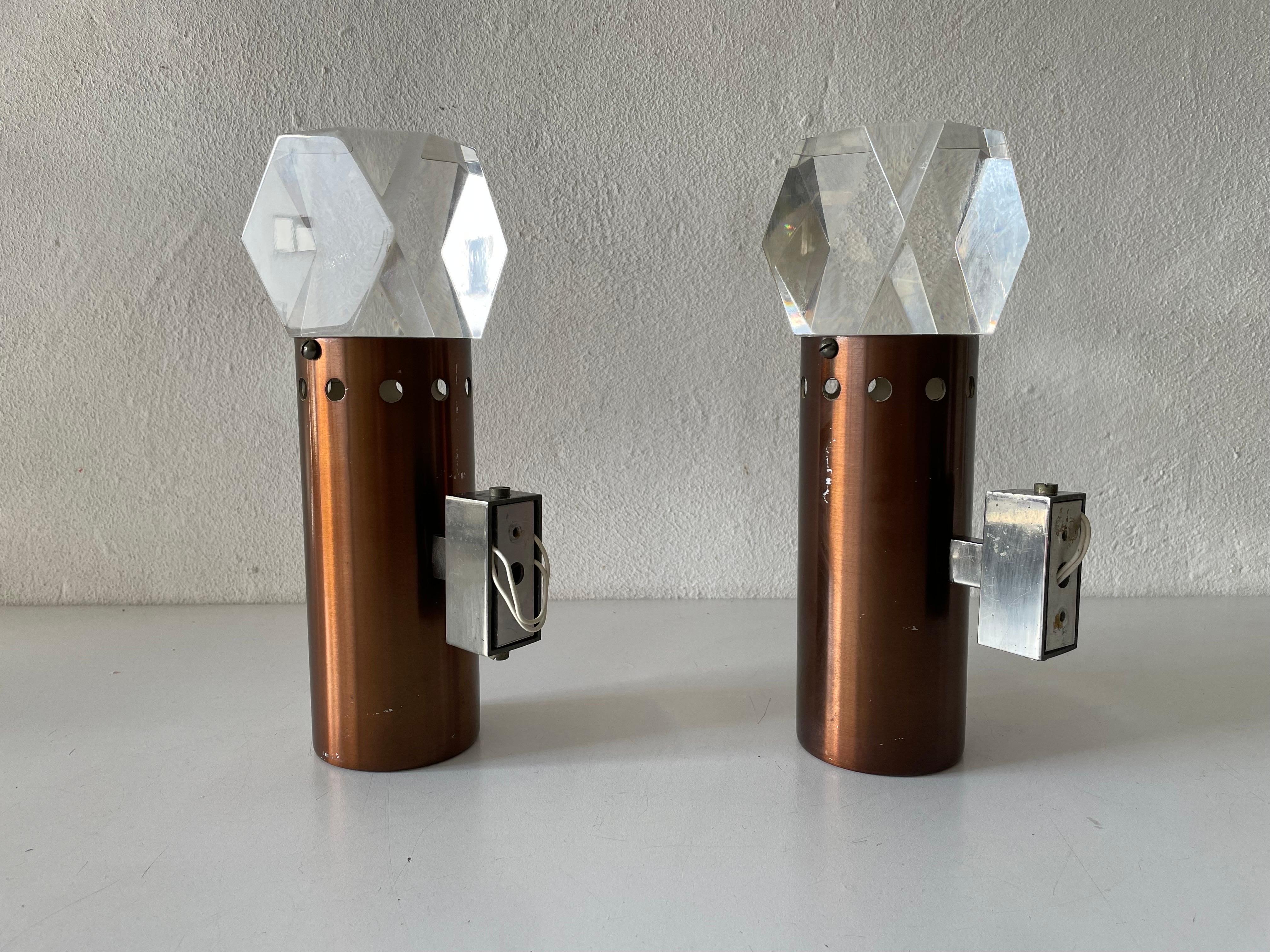 Rare Copper and Glass Sculptural Pair of Sconces by Stilux Milano, 1960s, Italy

Very elegant and Minimalist wall lamps
Lamp is in very good condition.

These lamps works with E27 standard light bulbs. 
Wired and suitable to use in all countries.