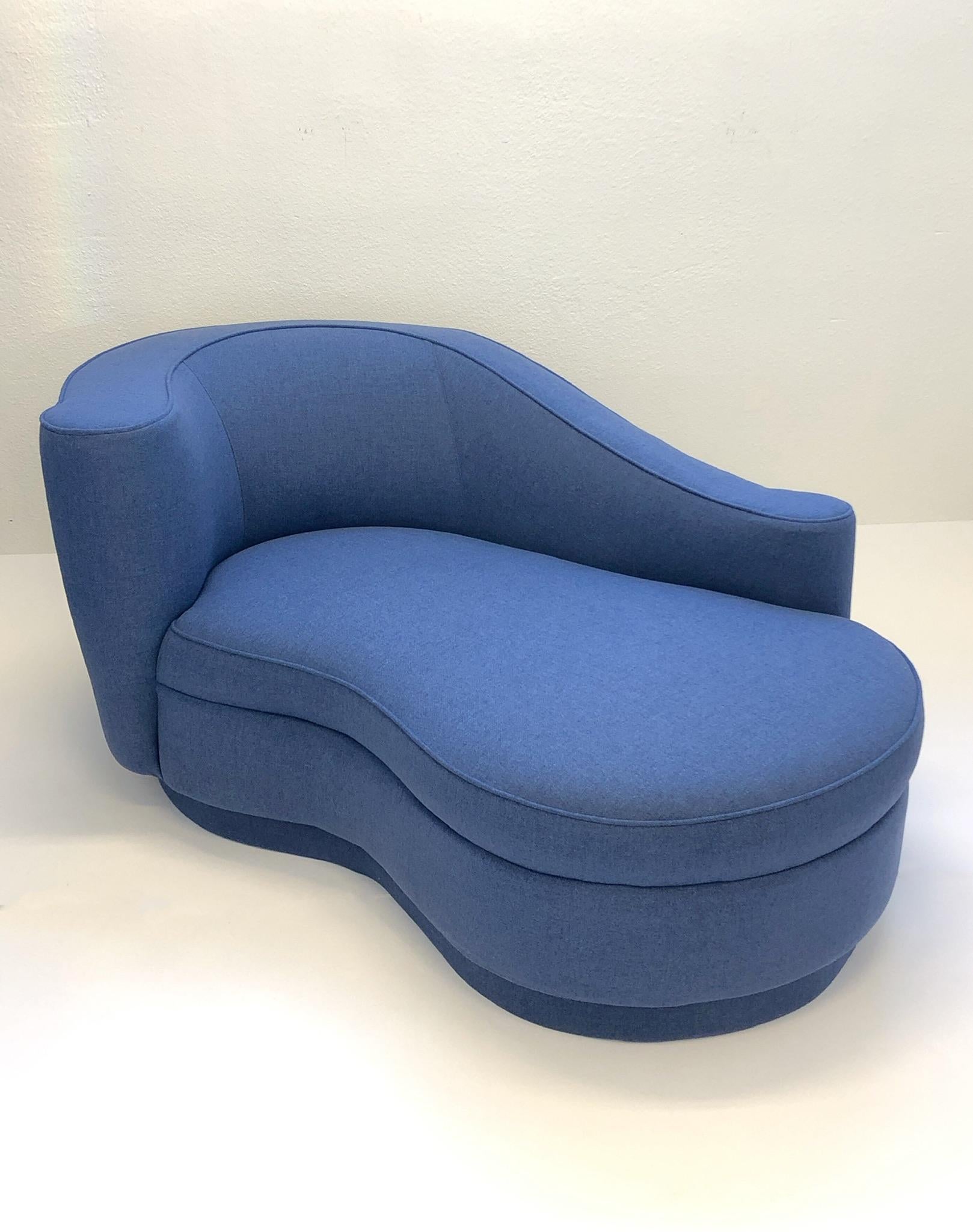 A spectacular “Corkscrew” chaise lounge. The chaise is upholstered in a blue knoll fabric. 

Dimensions: 30” high, 64” wide, 38” deep.