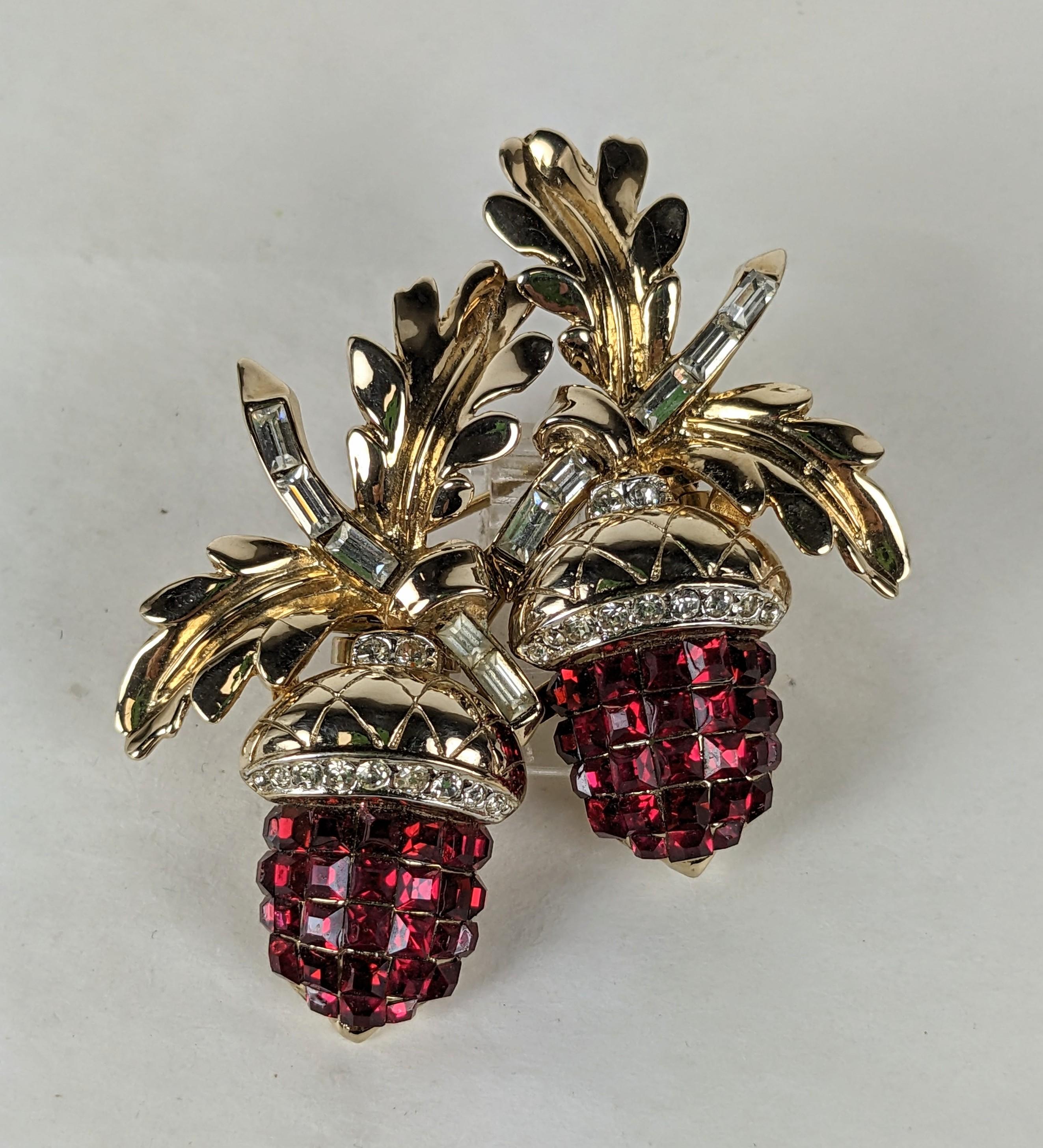 Rare Coro Invisibly Set Ruby Acorn Duette Clip Brooch from the 1930's. A pair of acorn clip brooches can be detached from its central frame. Acorn berries are set with square cut faux rubies and leaves are set with crystal baguettes. 1930's USA. 2