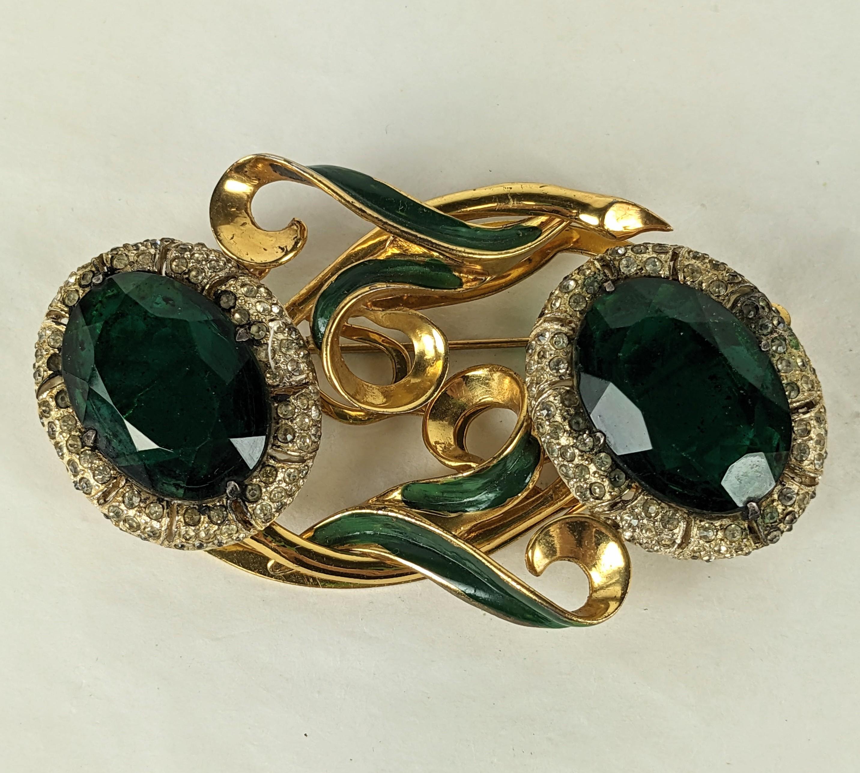 Large and Rare Coro Sterling Vermeil Lily Duette from the 1940's.  2 huge emerald oval pastes with micro pave borders form the flower heads with green cold enamel leaves. The  flowers release from the backing to be worn separately if desired. 1940's