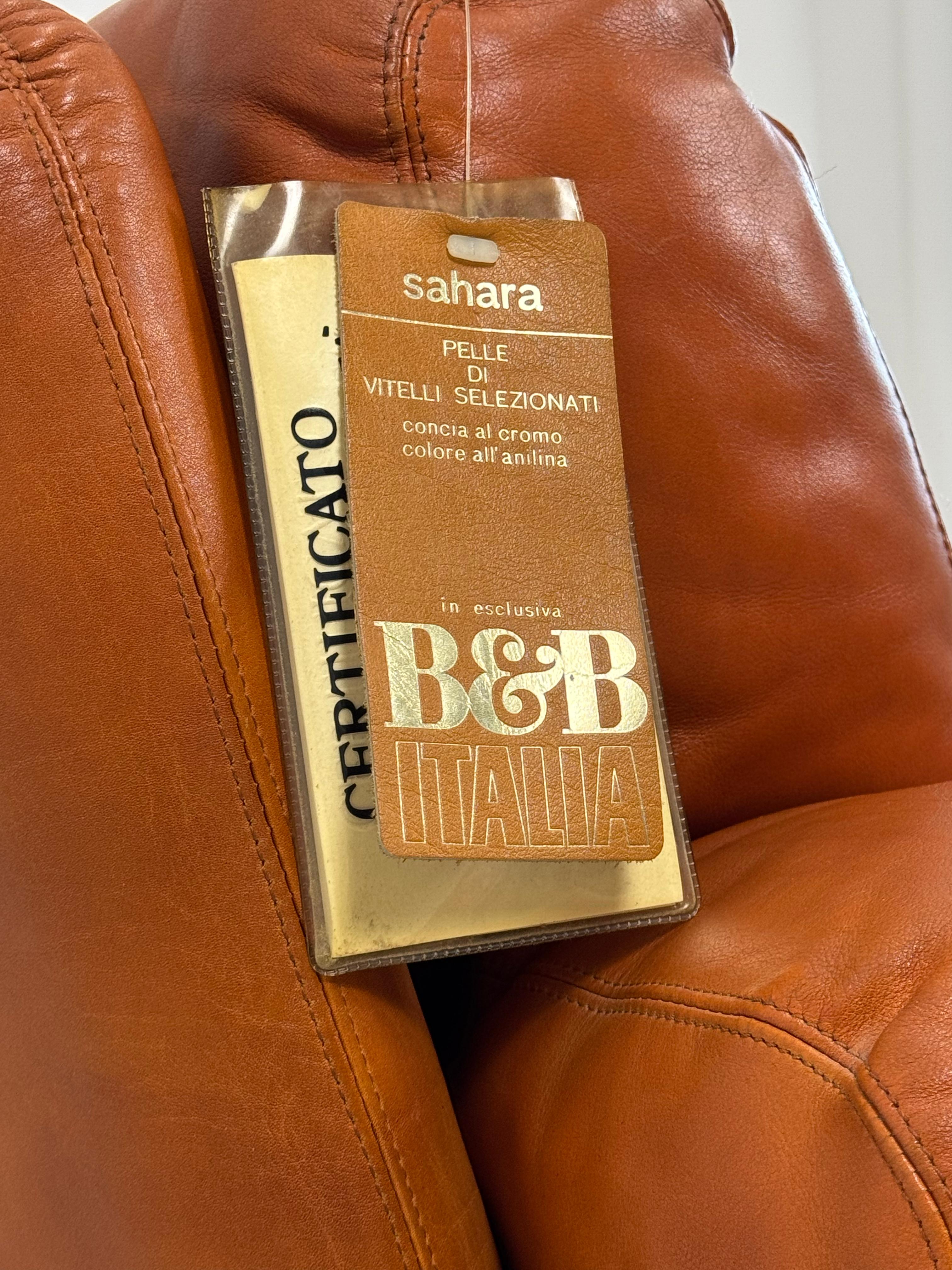 Sillón Coronado de cuero color tabaco de Tobia Scarpa para B&B Italia 1974, raro con etiqueta original y certificado de autenticidad.

Es totalmente original y está bien conservada. Esta pieza icónica presenta una silueta suave y voluminosa que
