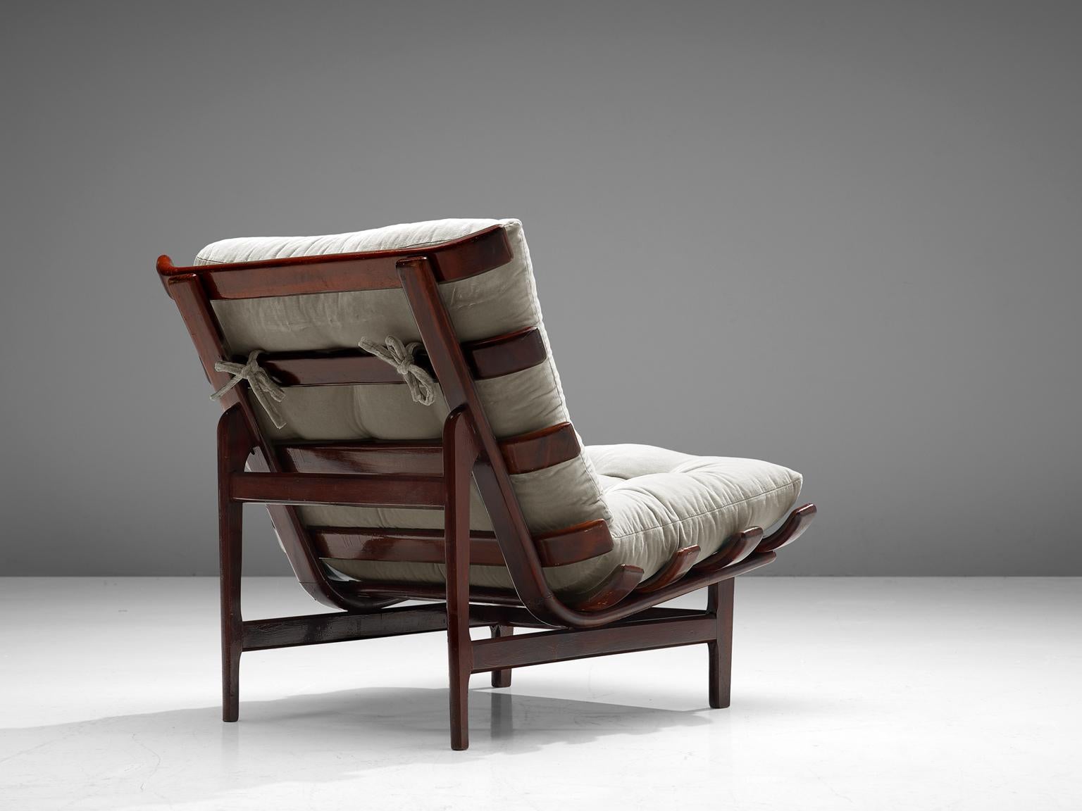 Móveis Pailar, lounge chair, rosewood, Brazil, 1960s.

Wonderful chair with rhythmic frame that reminds of an organic rib structure. The frame is completely executed in solid rosewood and finished with thick, tufted cushions that you can take off as