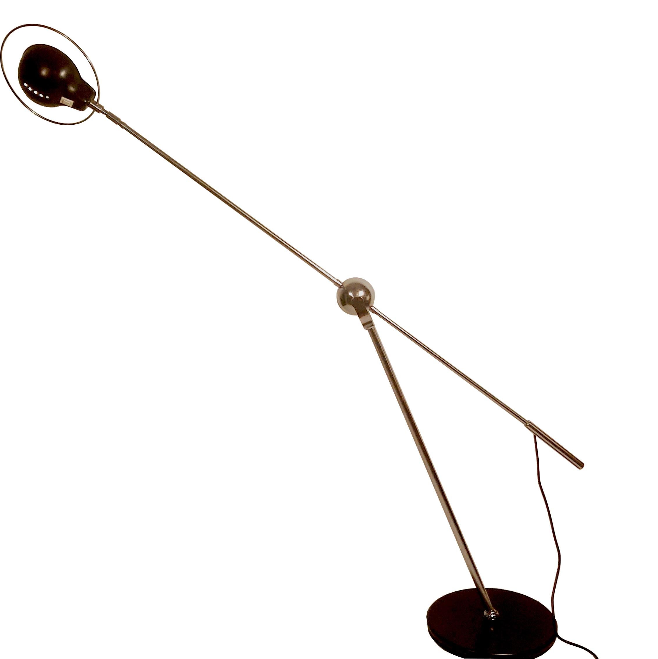 Very unique counter balance floor lamp, 1960s. The balance arm has a chrome globe joint and is adjustable up and down and can rotate, the standing shaft has a ball joint at the ground base plate and is adjustable, the shade is adjustable and can