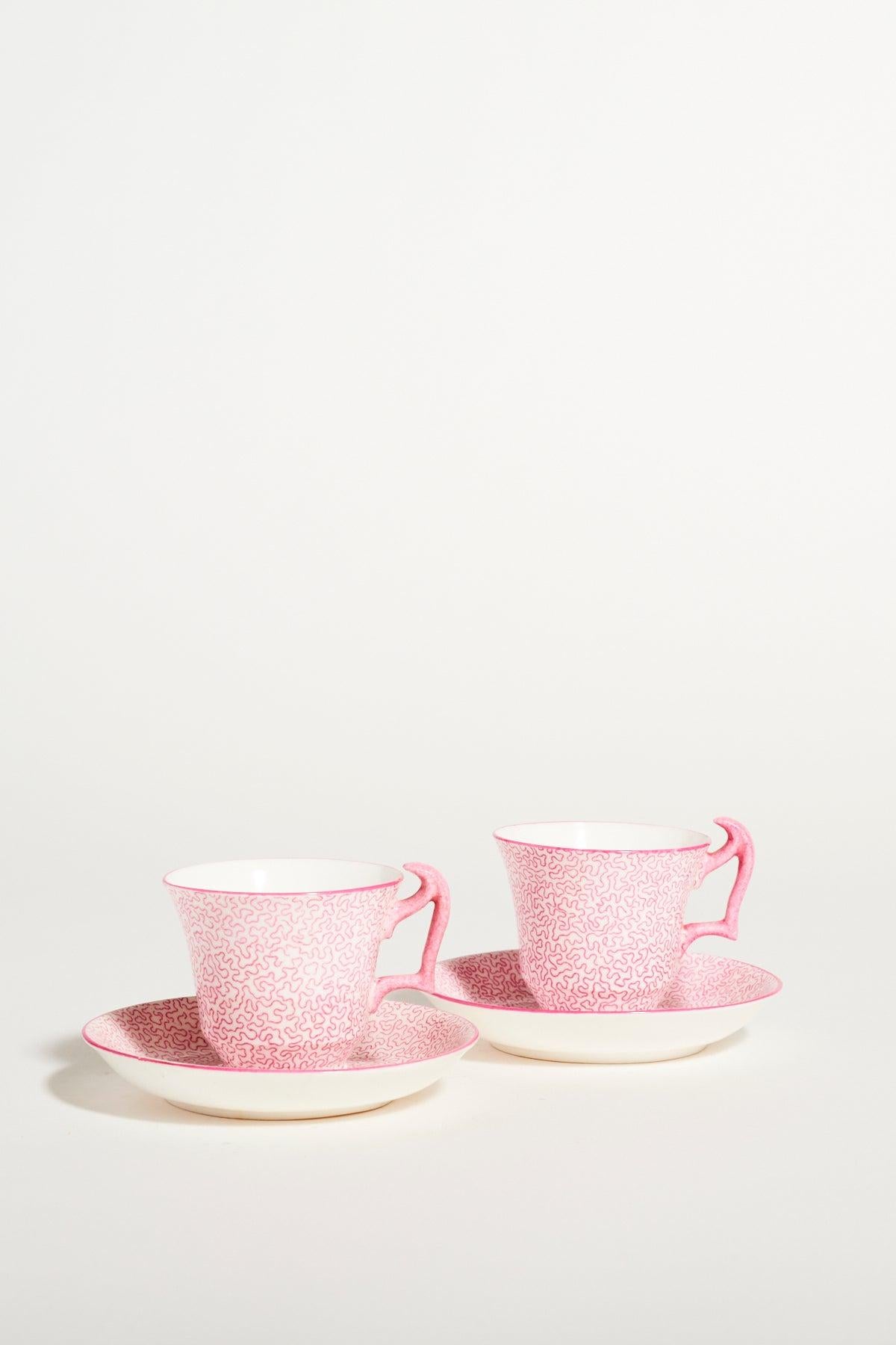 Pair of rare Crown Staffordshire cups in pink squiggle pattern, features elaborate 'London' style handle.