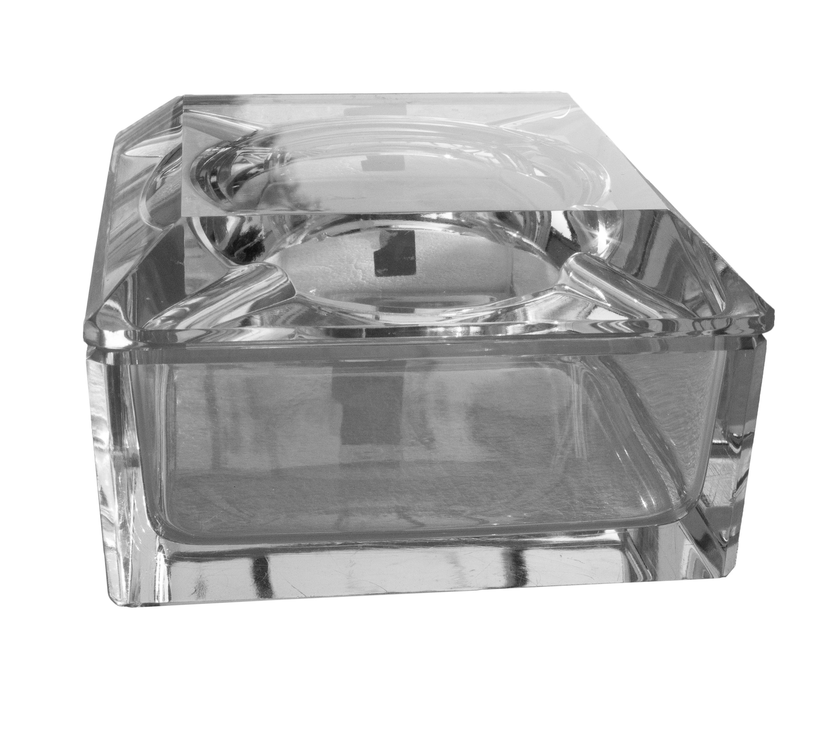 Striking and heavy crystal ashtray made by the prestigious Belgian glassmaker Val Saint Lambert. This particular piece was a special commission for Texaco, featuring the original label and etched signature on the base. Produced in the 1960s, likely