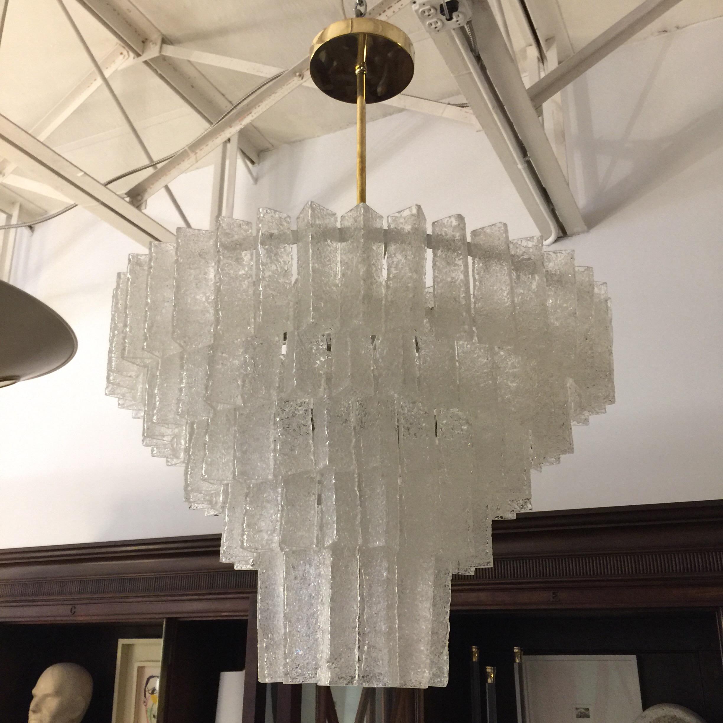 An original vintage 5-tier chandelier from the 1960s with triangular shaped pieces with textured glass that looks like crystalized sugar.
An unusual Italian masterpiece by Seguso - shaped in descending spheres, providing beautiful lighting. (12