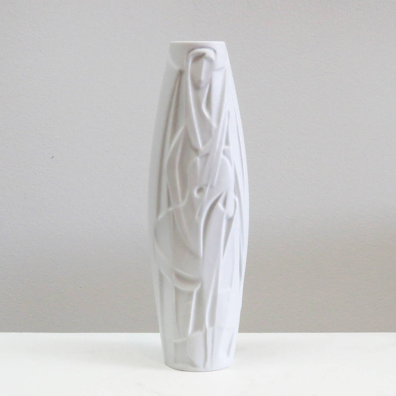 Stunning bisque porcelain Op-Art vase with abstract relief of a female musician, designed by Cuno Fischer for Rosenthal Studioline, marked.