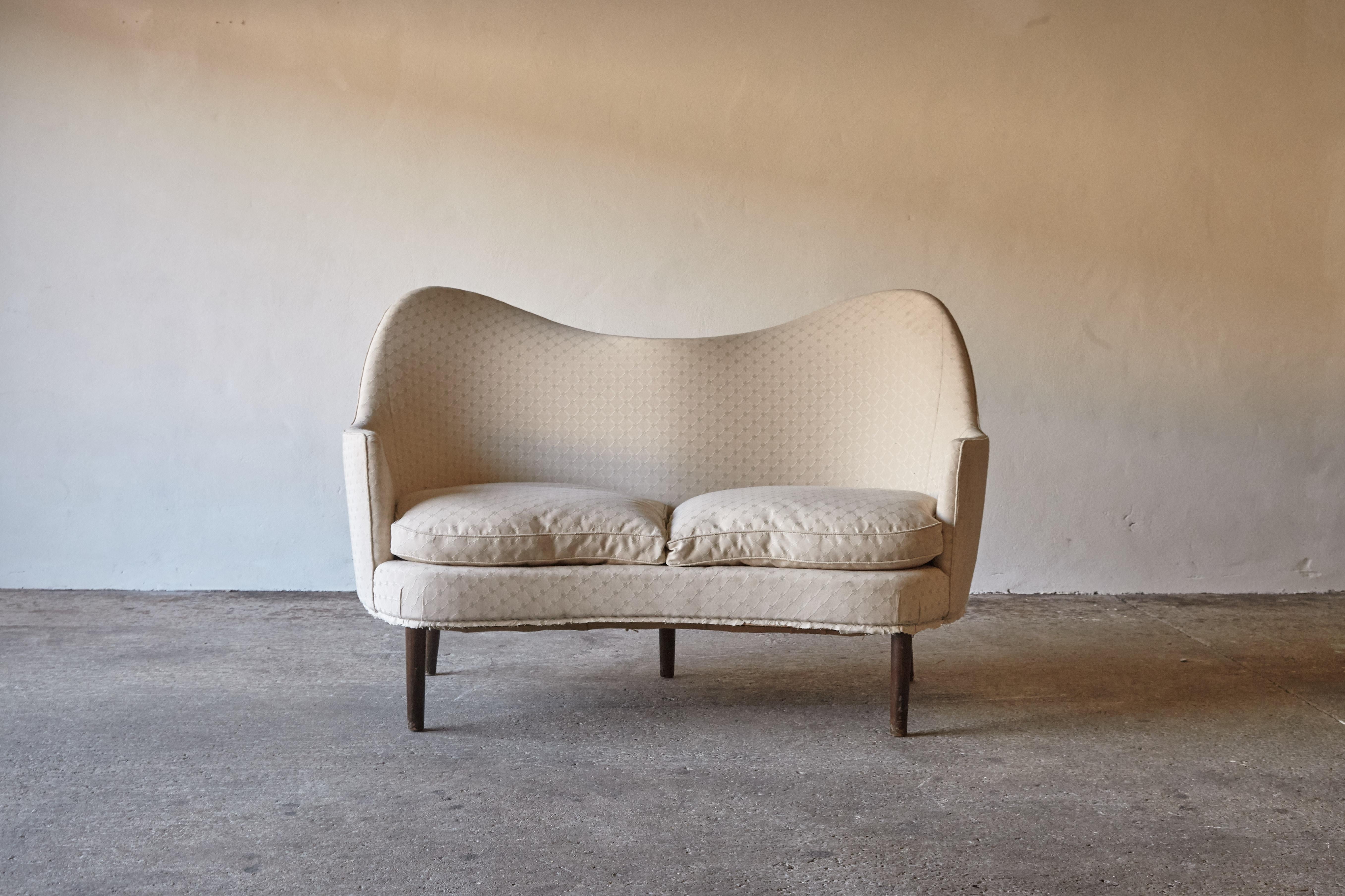 1950s 2 person love seat sofa from Denmark. Amazing curves. Similar in style to Finn Juhl's designs from the same era. In original condition with spring base and feather cushions.

We offer a re-upholstery service for this item.

Measures: