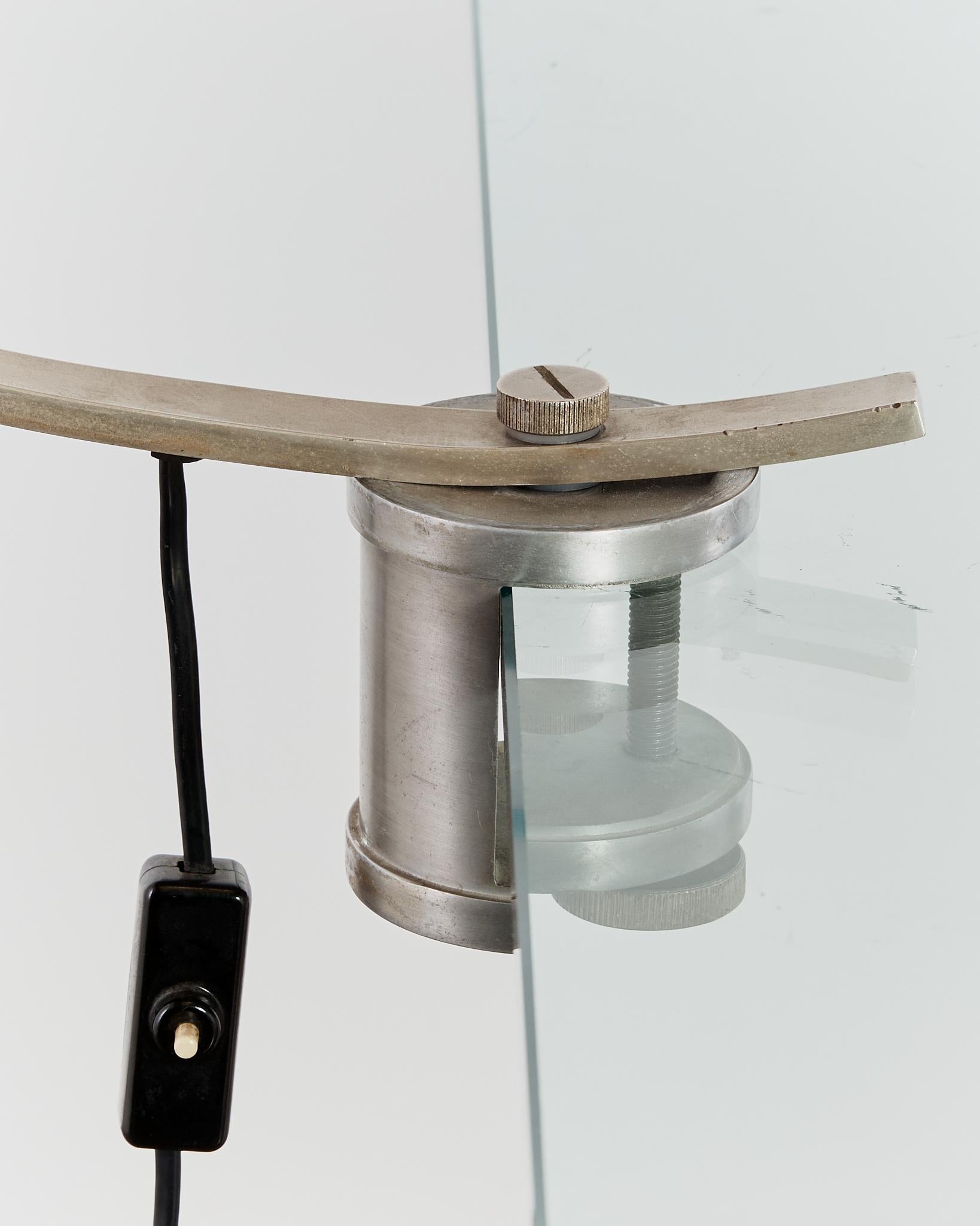 Rare curved 'Witch' lamp by Alonso Cagozzi for Philips with mechanical clamp 4