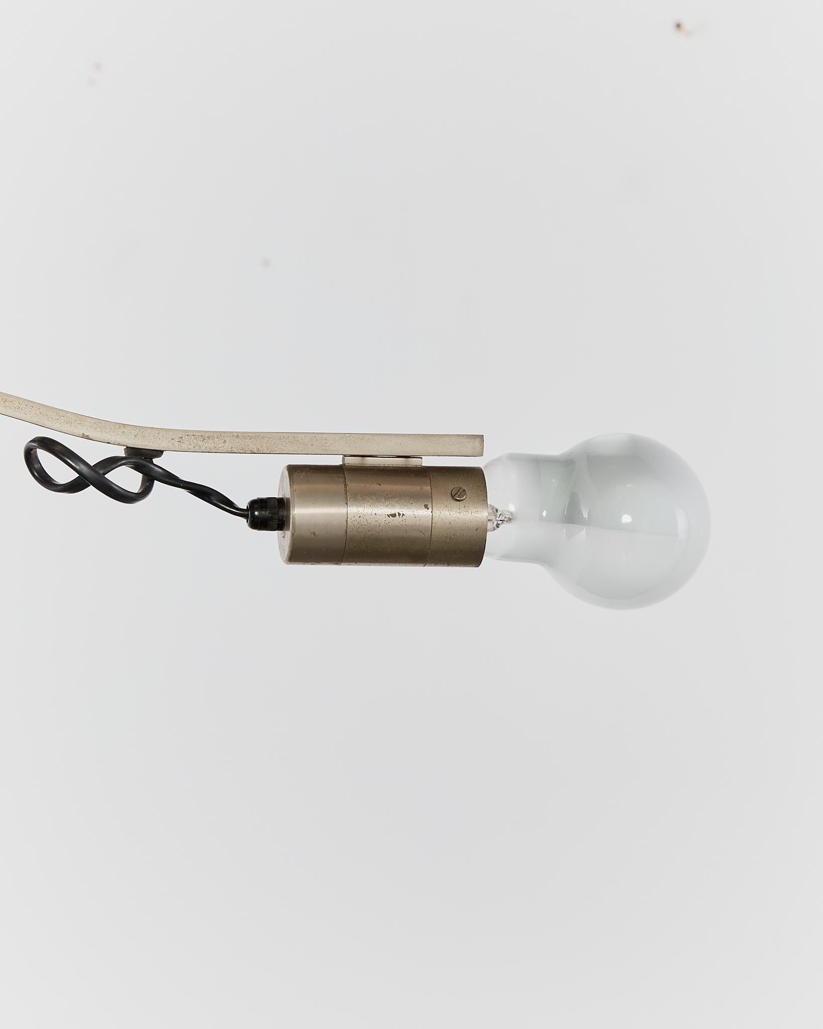 Stainless Steel Rare curved 'Witch' lamp by Alonso Cagozzi for Philips with mechanical clamp