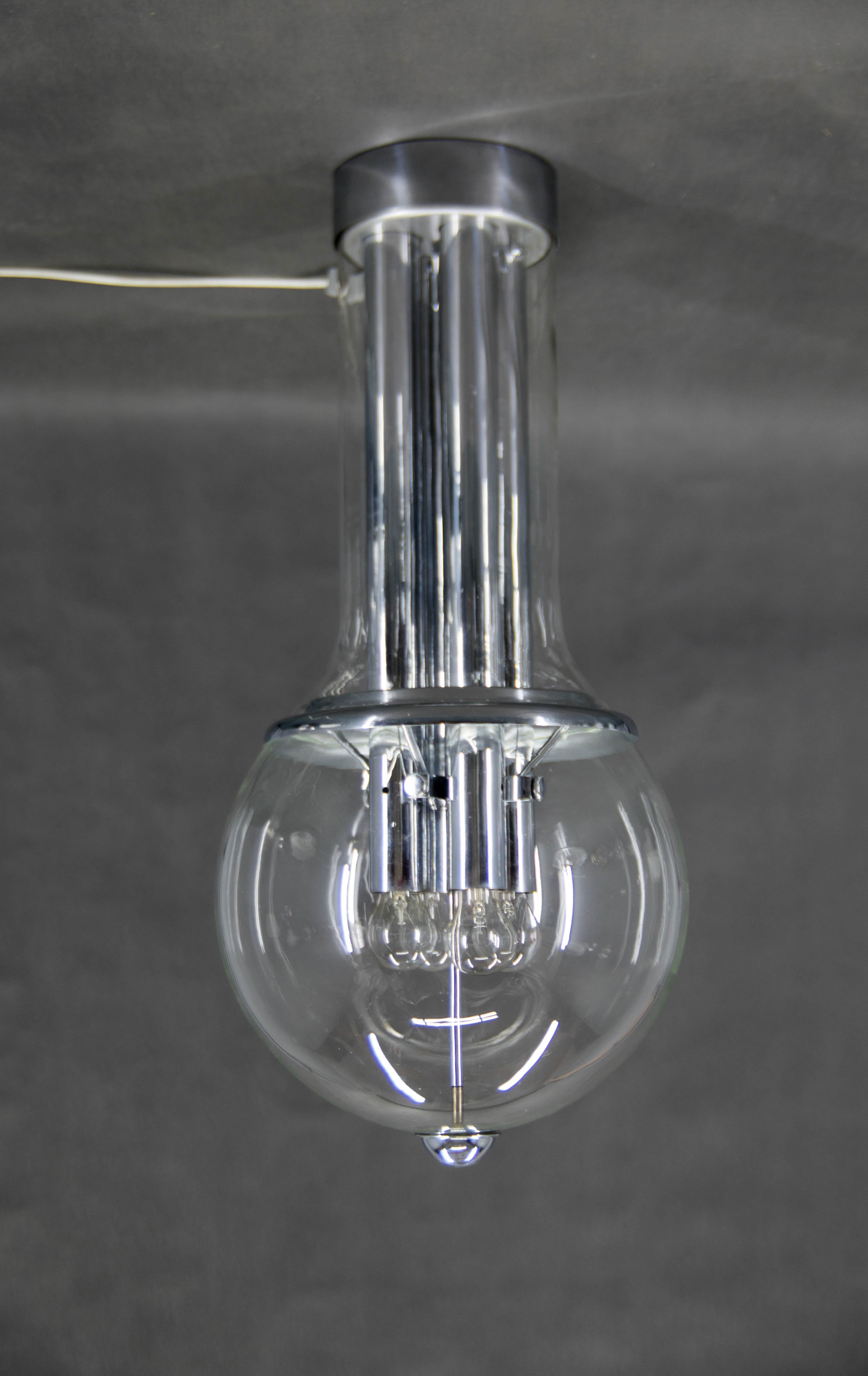 Huge and heavy Brutalist flush mount designed and custom made for Central Railway Station in Prague in 1970s. Only few pieces were made.
Chrome construction with two clear glass pieces.
Very good original condition.
4x60W, E25-E27 bulbs
US wiring