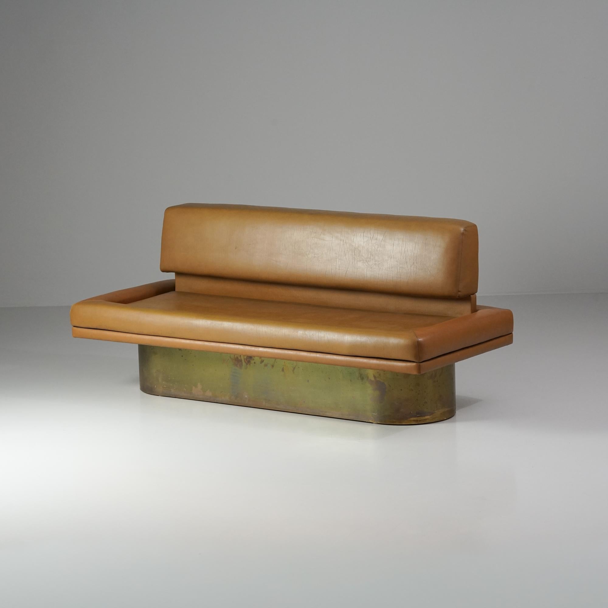 Rare sofa designed by Leena Kolinen in 1968 for the former headquarters of Yle (Finnish Broadcasting company). Wood, metal and brass frame with cognac leather upholstery. Good vintage condition, patina and small wear consistent with age and use. 