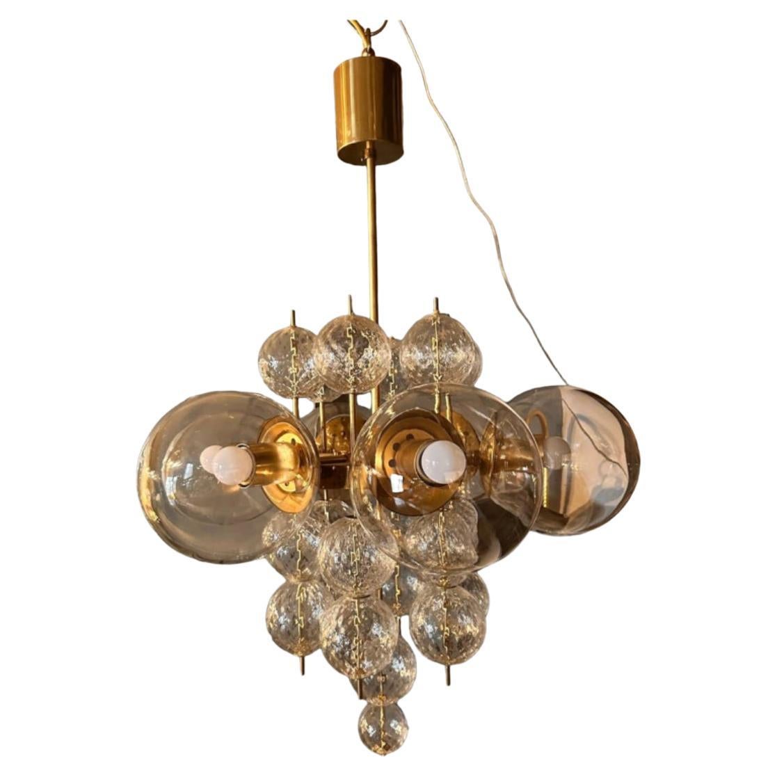 Rare cut glass and gilded brass chandelier circa 1970 For Sale