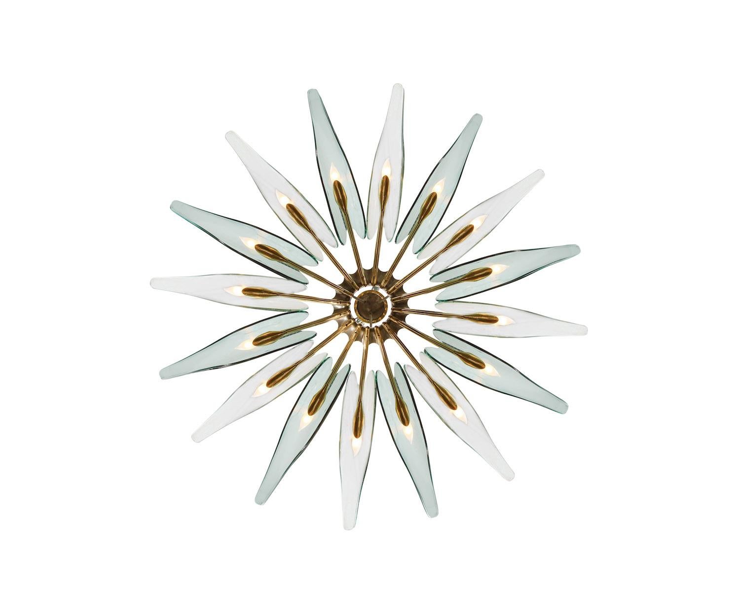 Rare Dahlia Chandelier by Max Ingrand for Fontana Arte.  16-light fixture of oxidized brass and nickeled metal. Each arm has an elongated glass petal and one candelabra socket. Glass petals alternate between clear and pale green colored glass.