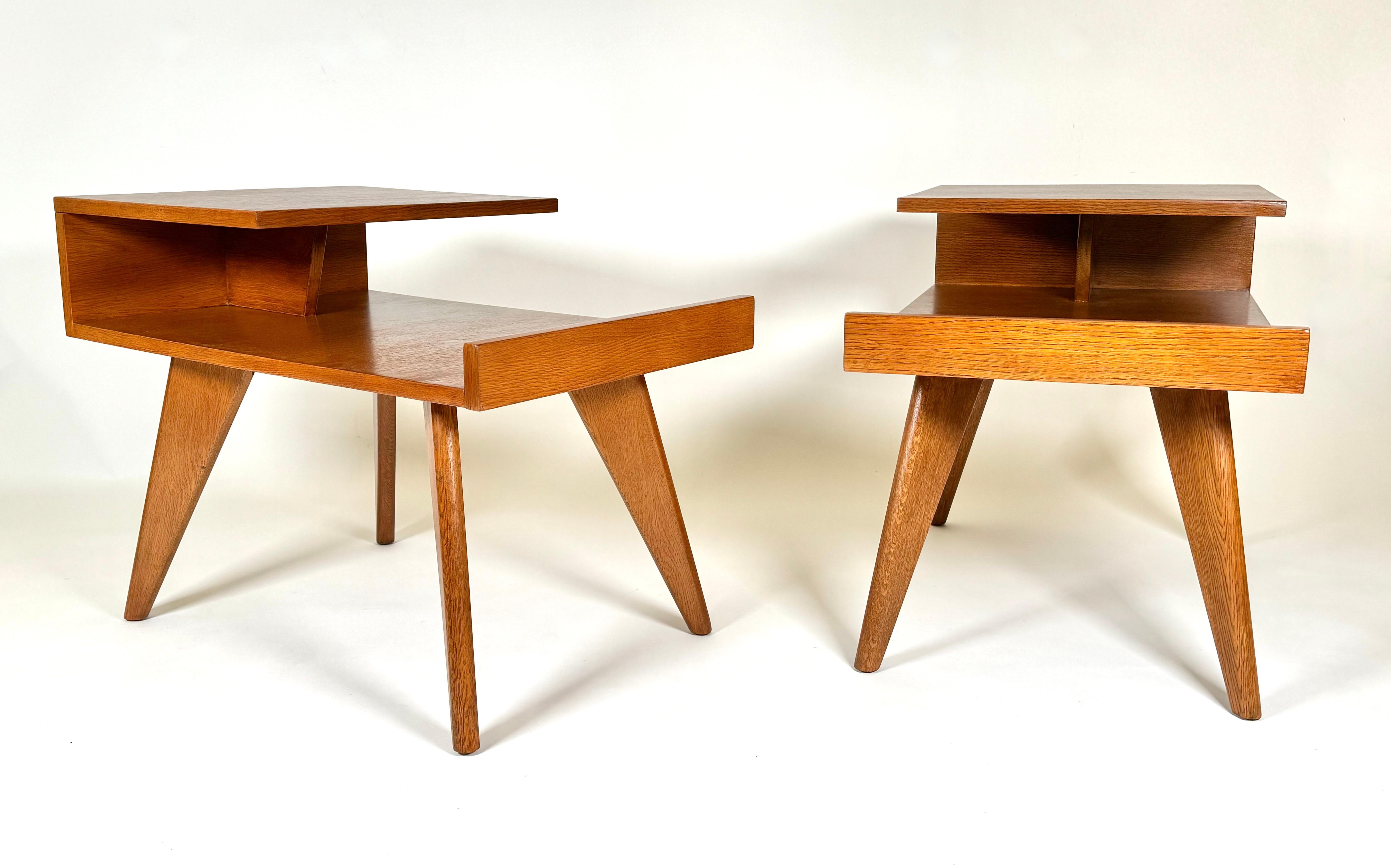 An early design by American  Dan Johnson (1918-1979) for Hayden Hall Furniture, a pair oak side tables with cantilevered tops and striking triangular legs, his early designs had strong architectural lines, similar to the work of architects Richard