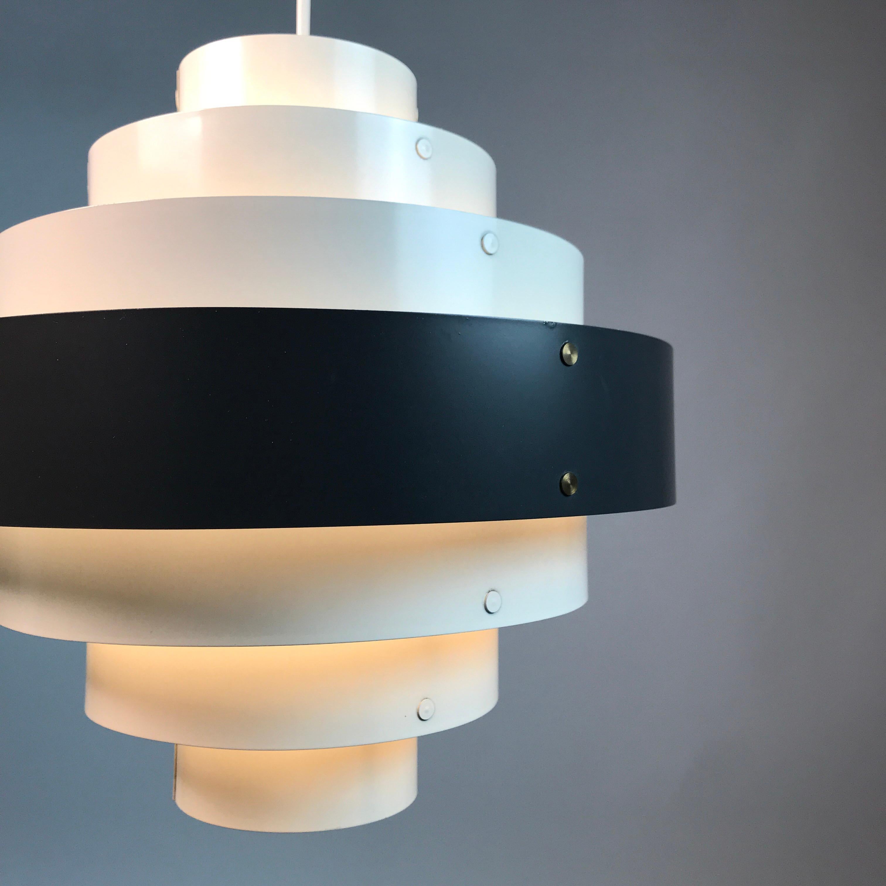 Classic Danish ceiling light of very high built quality made in the 1960s in Denmark.

Color sheme, built quality and thickness of the metal shades is similar to renowned Preben Dal design for Hans Følsgaard AS. 

It’s hard to tell if this