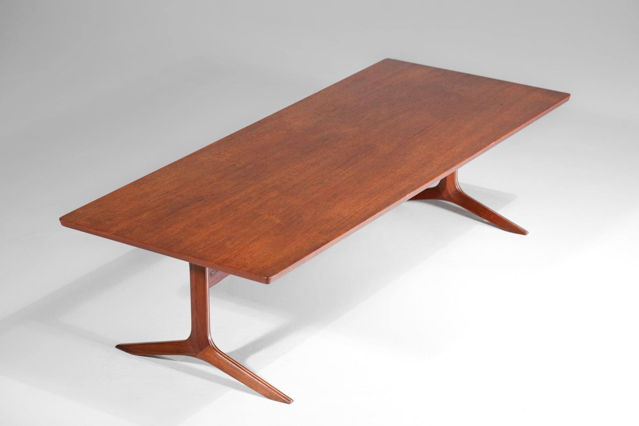 Scandinavian coffee table by Danish designers Peter Hvidt and Oral Molgaard from the 1950s. Solid teak top and legs, with two lines of inlaid metal on each leg, which gives them even more relief. Excellent vintage condition ( see pictures ).