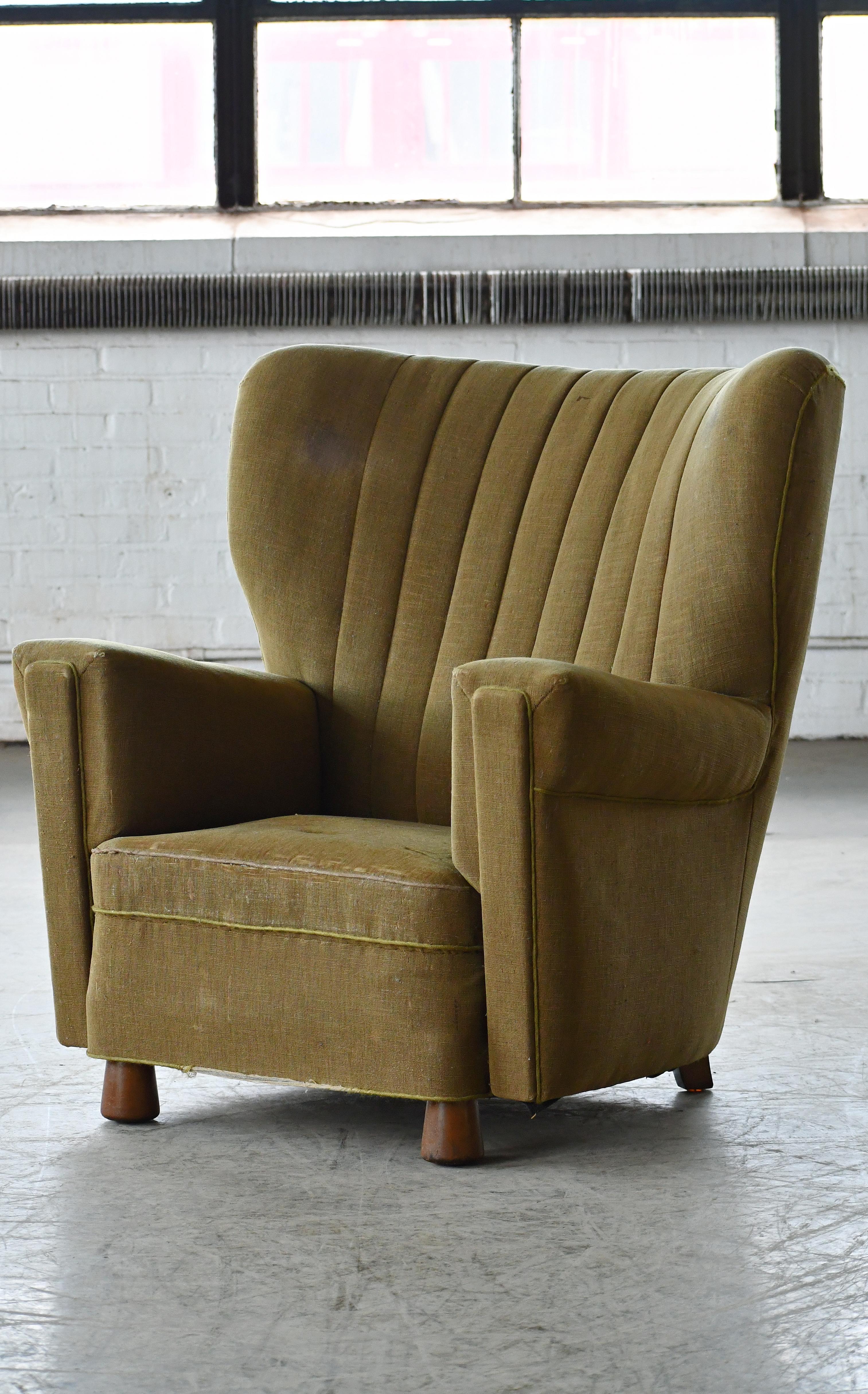 Incredibly comfortable, exuberantly designed large lounge chair. The style is very much that of Otto Færge and true to his style and design proportions that perfectly captures the essence of 1940s Danish design coming out of the Art Deco era and