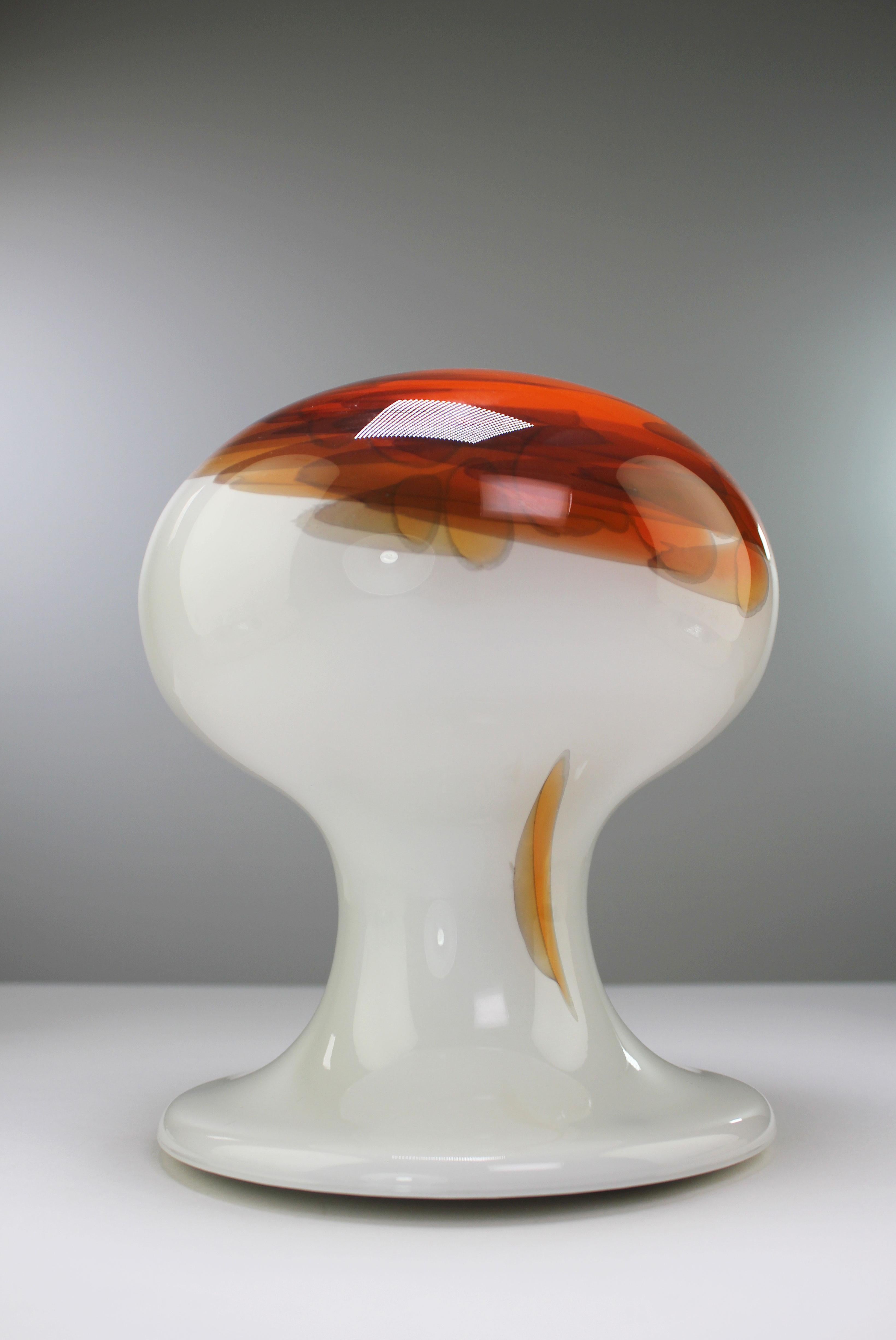 Unique, mouthblown Danish Mid-Century Modern mushroom shaped mouth blown art glass table lamp with organic decorations by Danish glass designer Per Lütken. Opaline bone white glass with orange, red and yellow fiery color accents. Manufactured in the