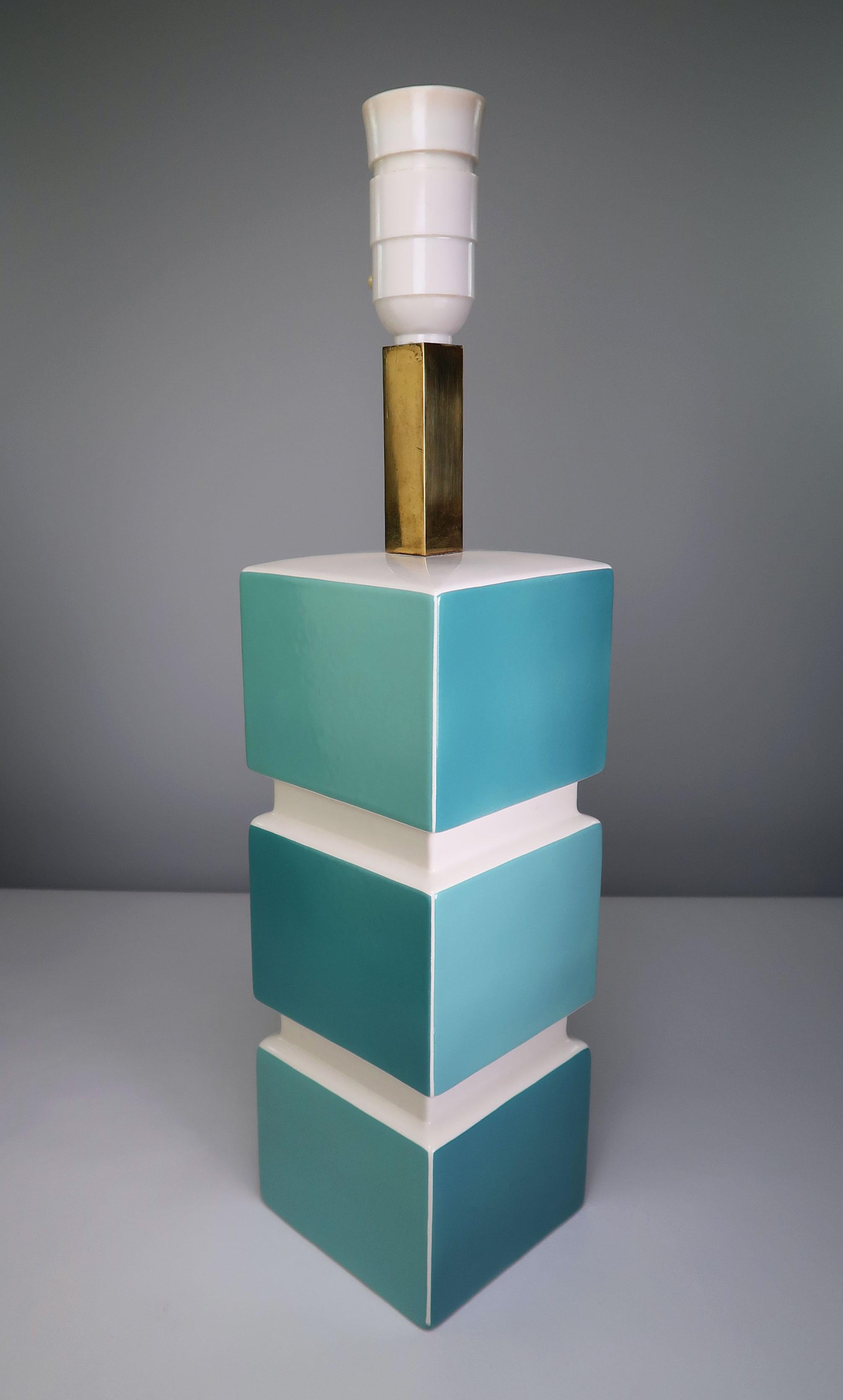 Rare, sculptural and geometric Italian inspired Danish modernist porcelain table lamp by Søholm Stentøj. Glazed squares with nuances of turquoise aqua blue interchanging on the four sides of the rectangular lamp base with chalk white top, spacings