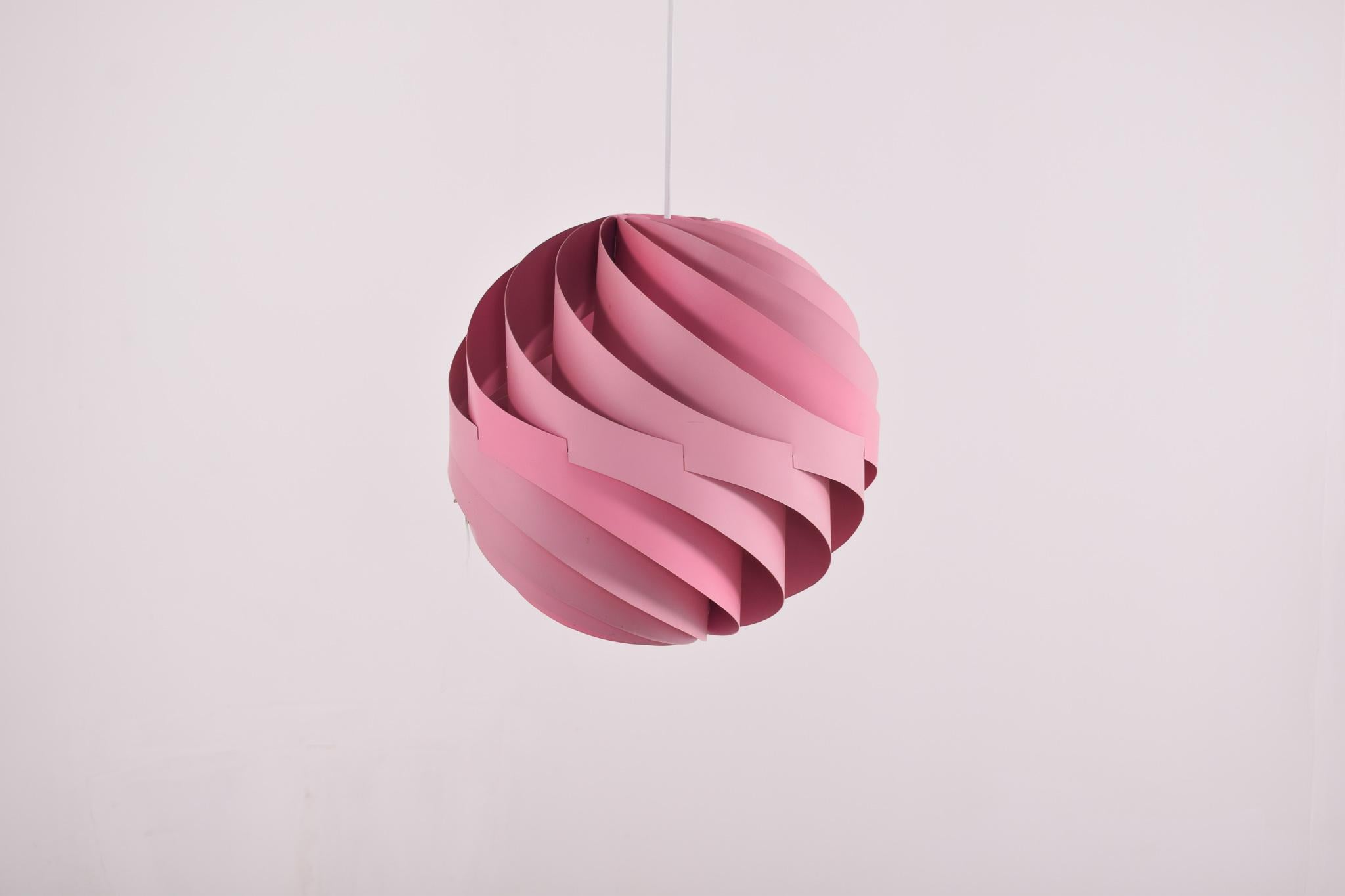 Weisdorf is known for some of the most beautiful Danish lighting designers and the Turbo is no exception. The original turbo ceiling light was made in white, orange and this pink lacquered version in 1967 by Louis Weisdorf for Lyfa, Denmark. The