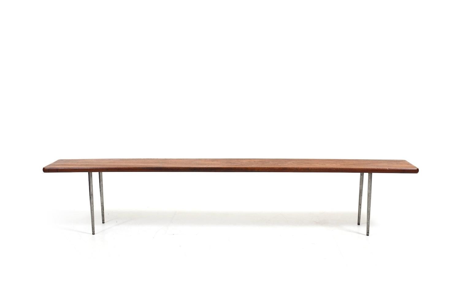 1960s danish bench / shoe bench in teak and conical round steel legs. In very good quality. Denmark 1960s. Looks like a design by Peter Hvidt & Orla Mølgaard.