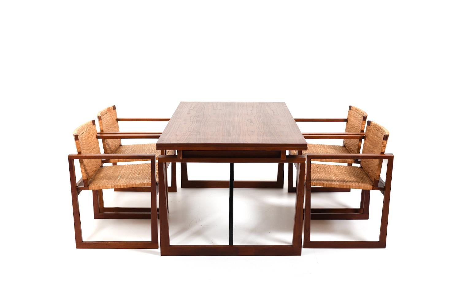 Beautiful danish Dining set incl. 4 armchairs with cane and extendable table up to 270 cm. Standing on a conical sled base. Made in teak and cane. Denmark 1960s. In very good quality.
Table: H. 73 cm / W. 150 cm - 270 cm / D. 86.5 cm
chairs: H. 73.5