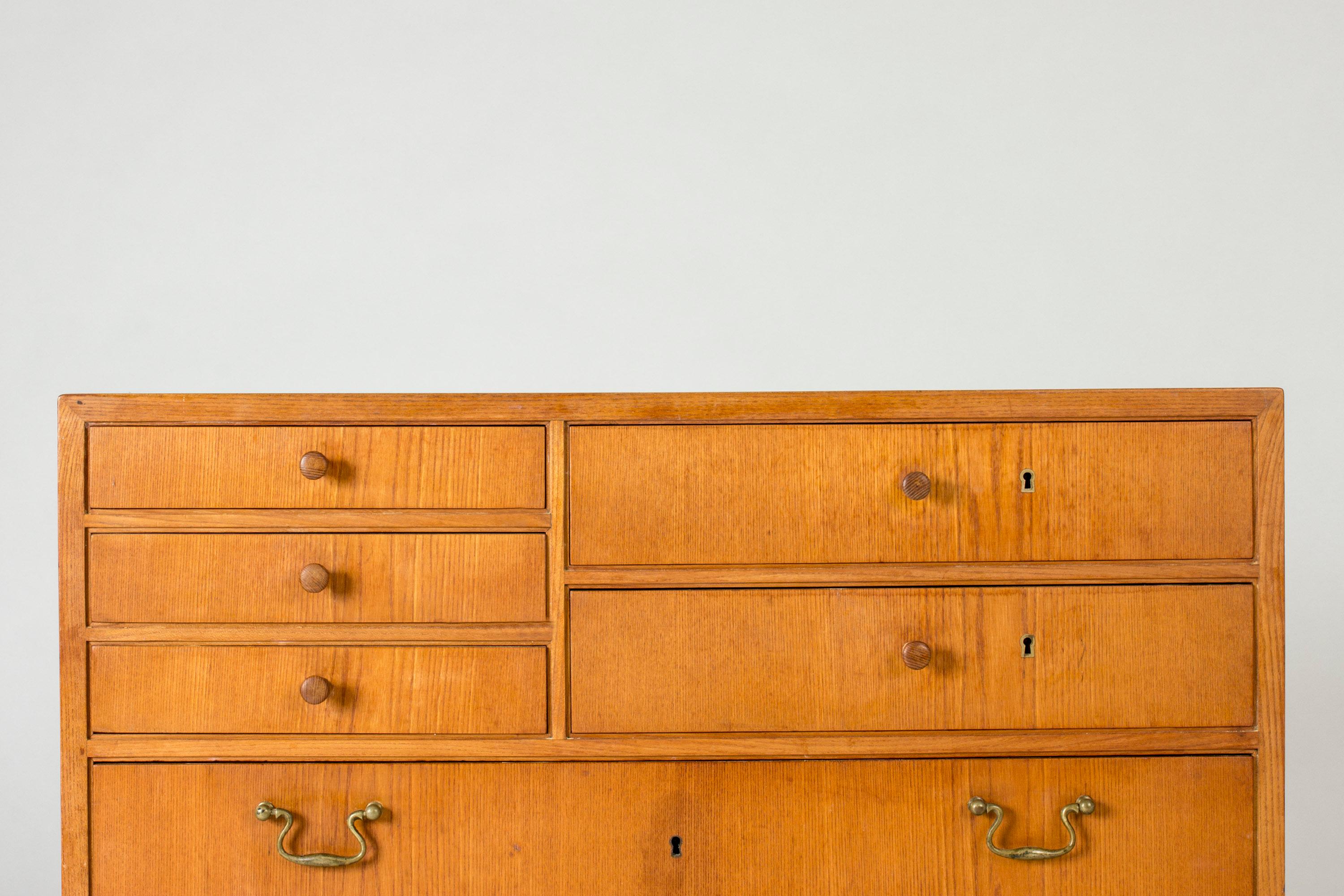 Rare teak chest of drawers by Egon Bro, designed in 1944. Five small drawers at the top and three big ones at the bottom. Nice contrast between the casual knobs on the small drawers and elegant brass ones on the below.
The chest of drawers was