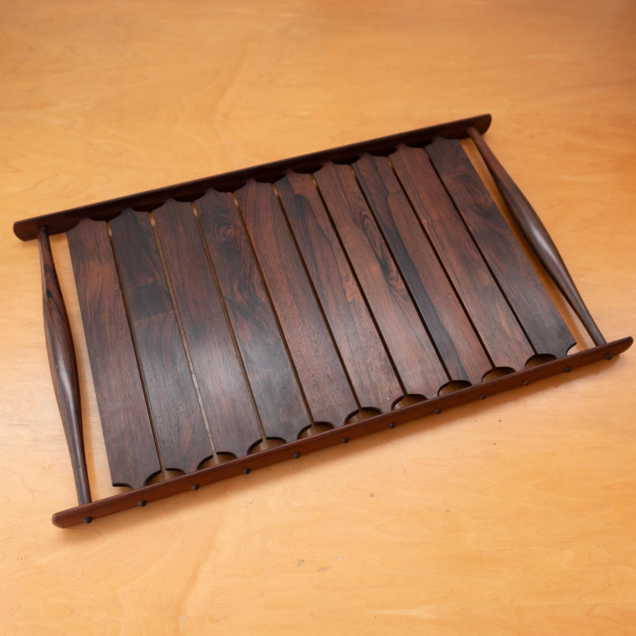 Monumental tray designed by Jens Quistgaard for the Dansk Rare Woods Collection. This is the holy grail of Quistgaard designs with the most intricate and craftsmanship. Constructed of solid Palisander Rosewood. The grain is pectacular. Introduced in