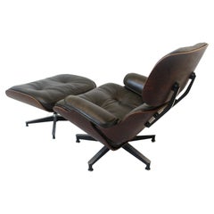Eames fauteuil de salon rare vert foncé/rosewood 670 avec pouf 