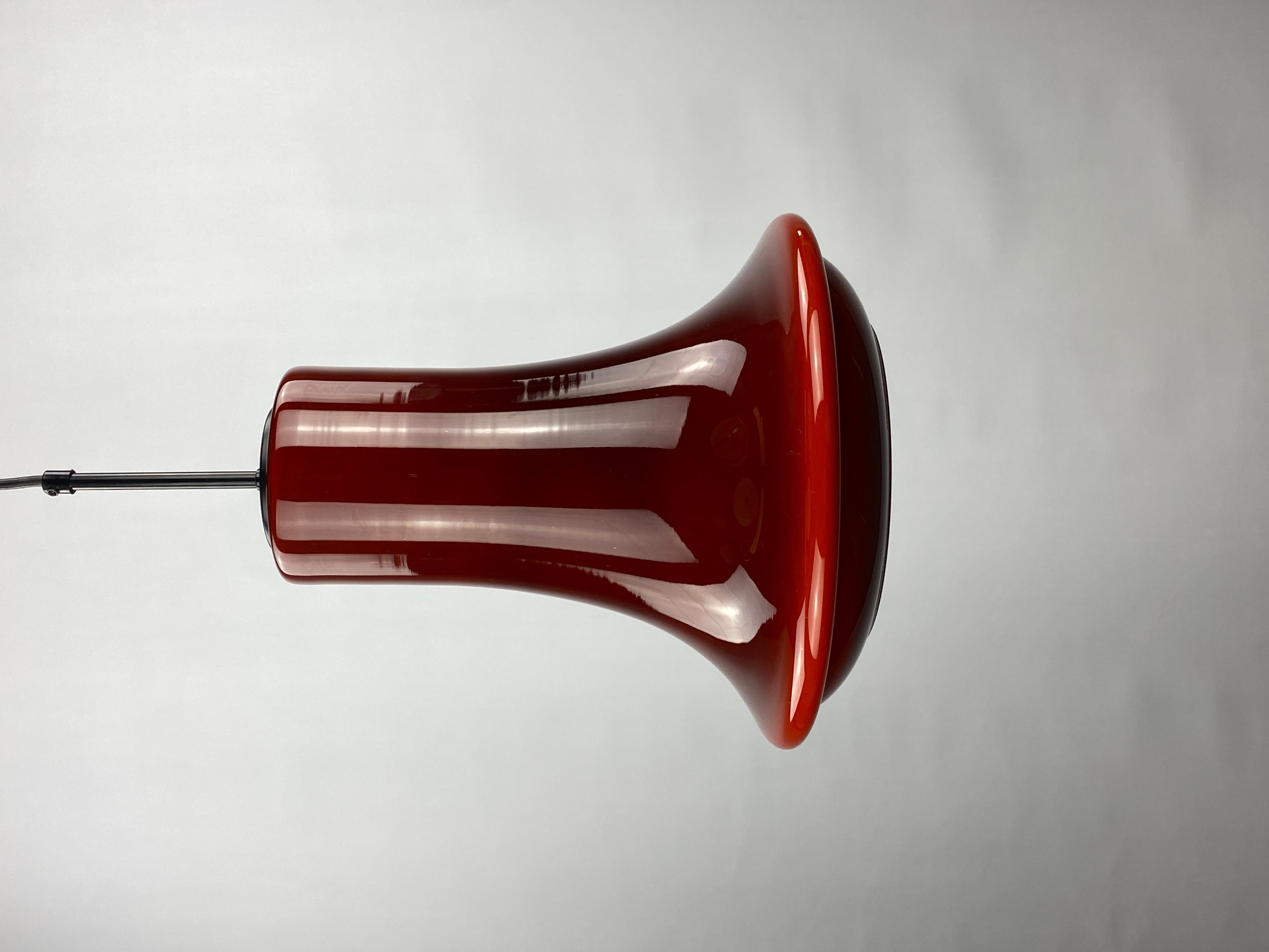 A rare dark red opaline glass pendant light. This pendant light is designed by the Swedish company Flygfors and designed by Viktor Berndt in the 1960's. 

More colored glass pendant lights in stock.

One lamp sold, one left.
Price is for one