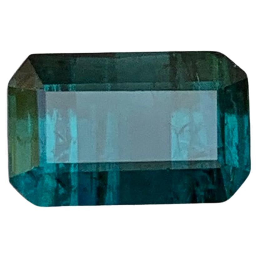 GEMSTONE TYPE: Tourmaline
PIECE(S): 1
WEIGHT: 2.35 Carats
SHAPE: Emerald Cut
SIZE (MM): 5.47 x 8.56 x 5.60
COLOR: Darkish Indicolite Blue
CLARITY: Slightly Included 
TREATMENT: None
ORIGIN: Afghanistan
CERTIFICATE: On demand
(if you require a