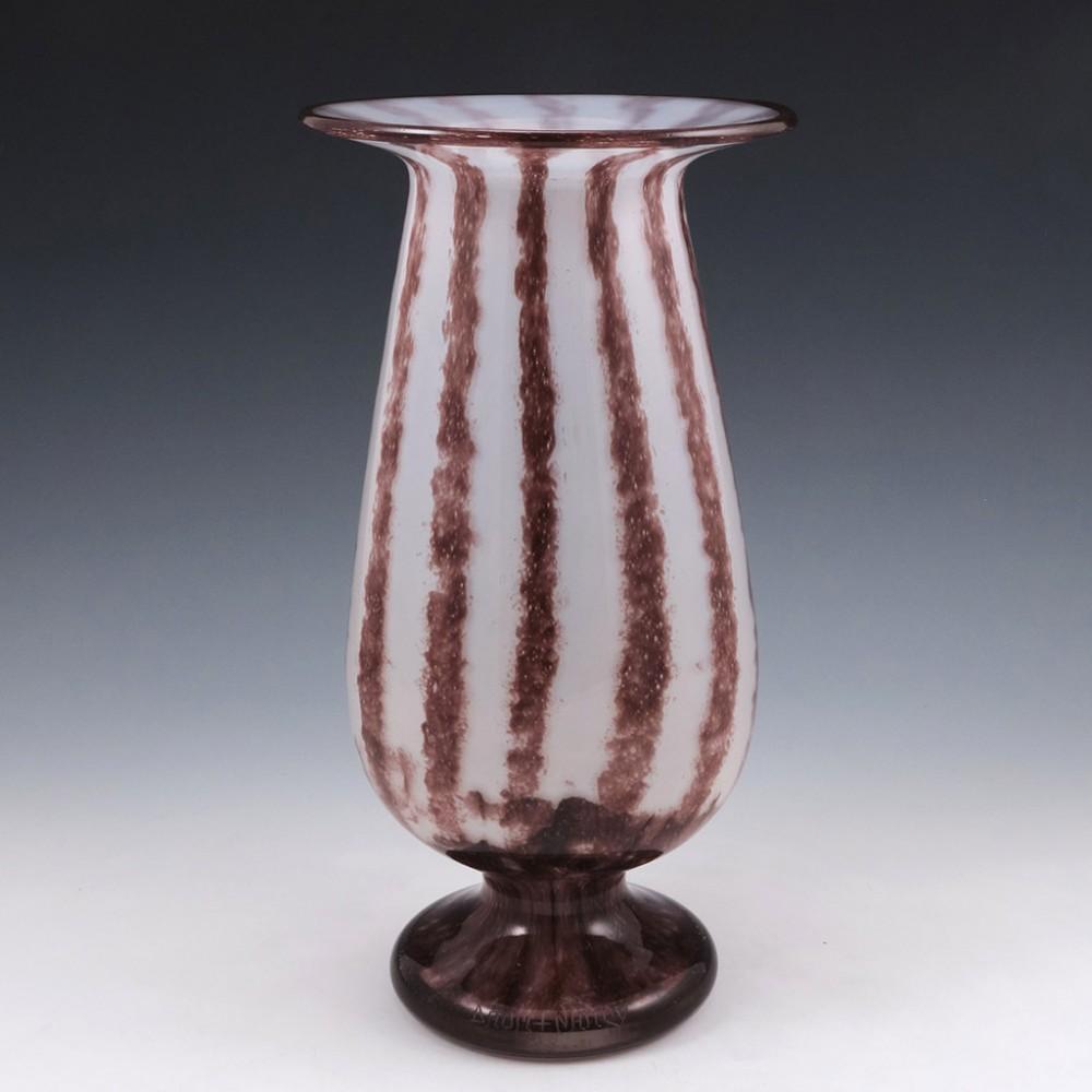 Rare Daum Intercalaire Design Vase, 1919-1923

Additional Information:
Heading : A rare and striking vase by Daum
Date : 1919-1923
Origin : Nancy, France
Bowl Features : Pale opalescent glass with aubergine stripes cased in clear glass. True