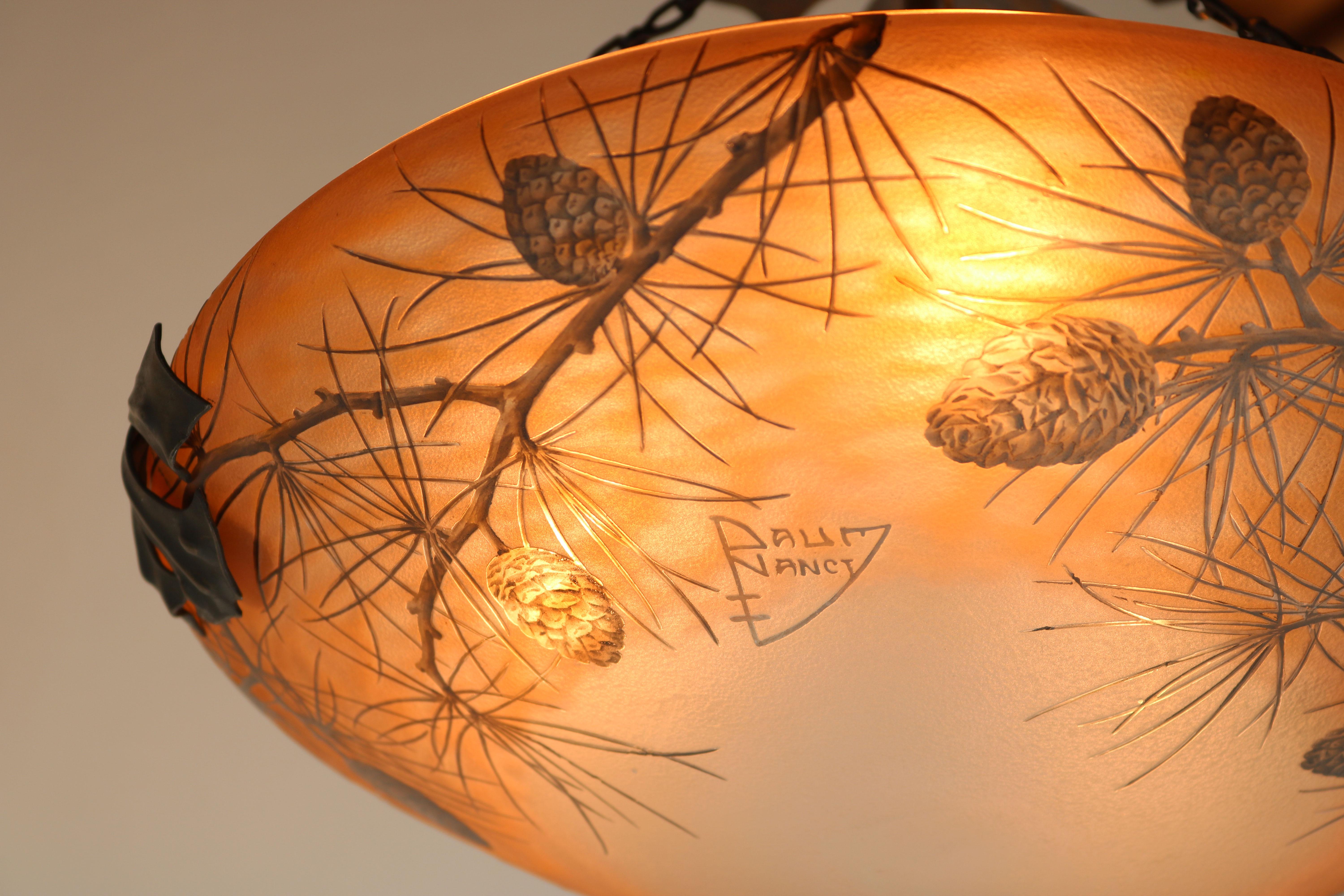 Most rare & breathtaking! This Daum Nancy ''Pinecone'' chandelier / ceiling light 1910 France in the Art Nouveau design style.
A very soft colour pallet decorated with branches & pinecones painted with enamel. Rare large model in amazing condition.