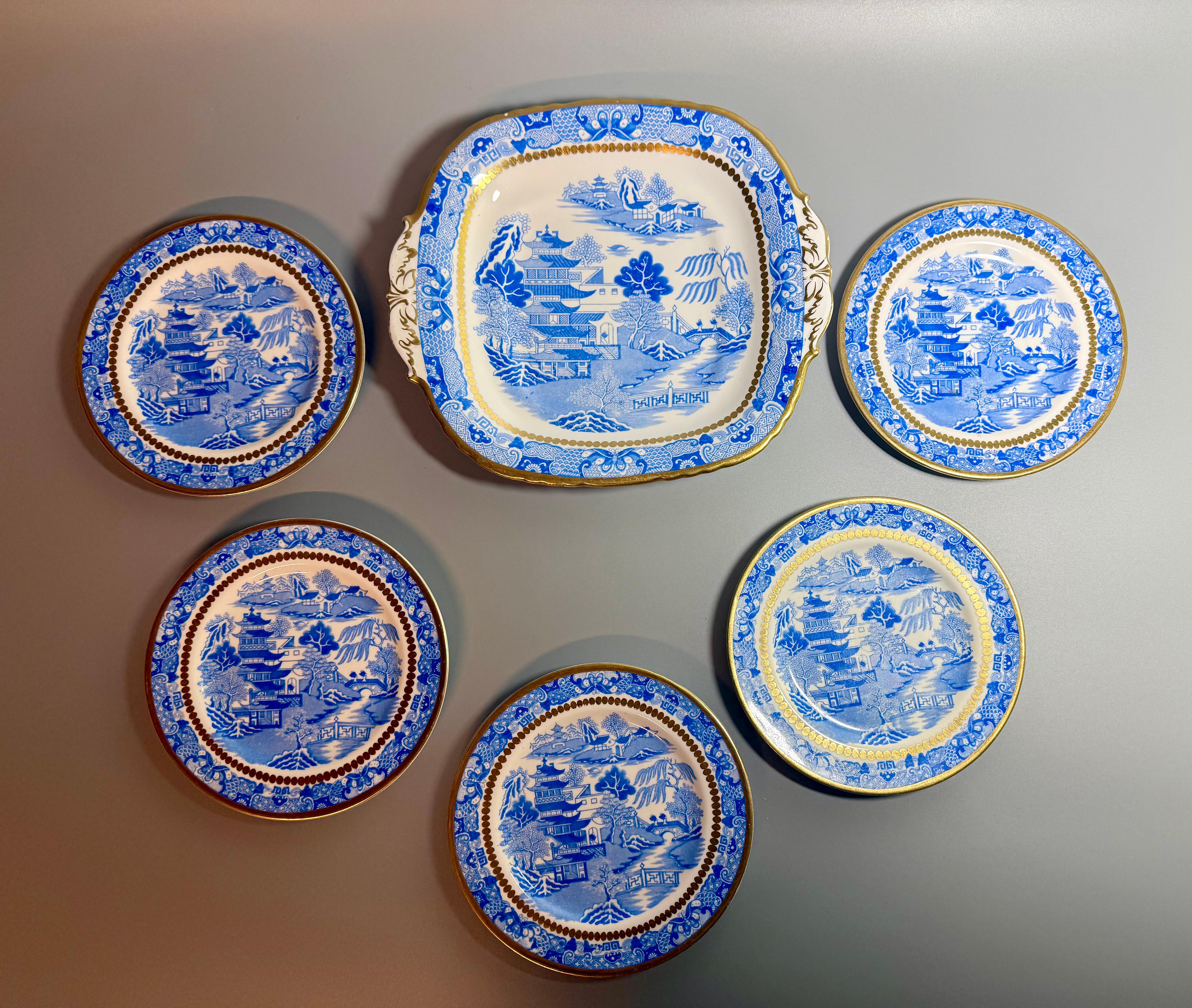 Canton Style Davenport England 
A beautiful porcelain dish and 5 side plates 
Printed in light to medium blue with the Two Temples chinoiserie pattern, the inner borders with distinctive gilt beading and rims also finished in gold.
 In excellent
