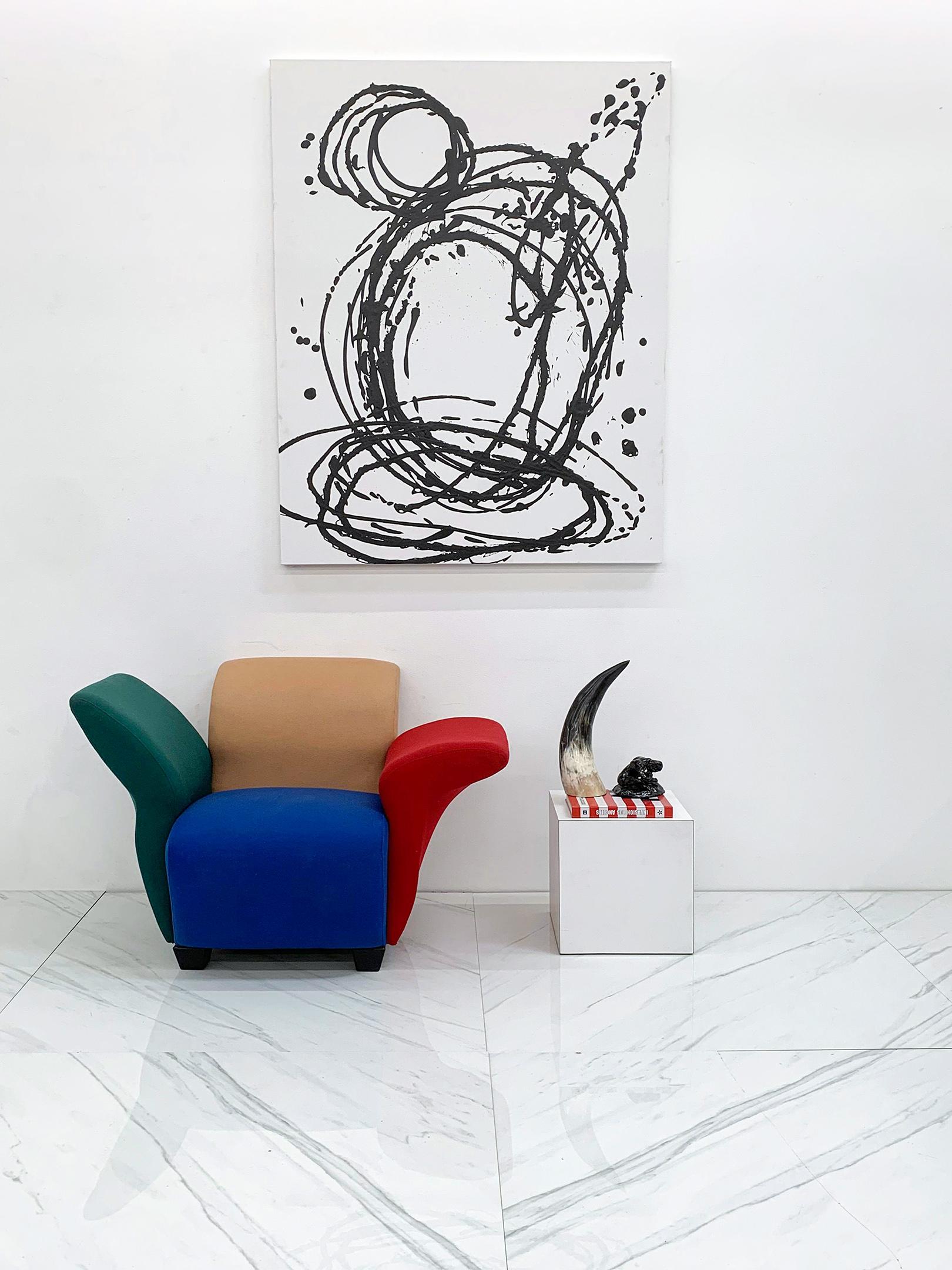 This David Burry lounge chair is absolutely stunning. Influenced by the Memphis Milano movement, David Burry designed this lounge chair in the late 1980's in Montreal, CA. With the squiggle lines, asymmetrical body and playful shape, this chair is a