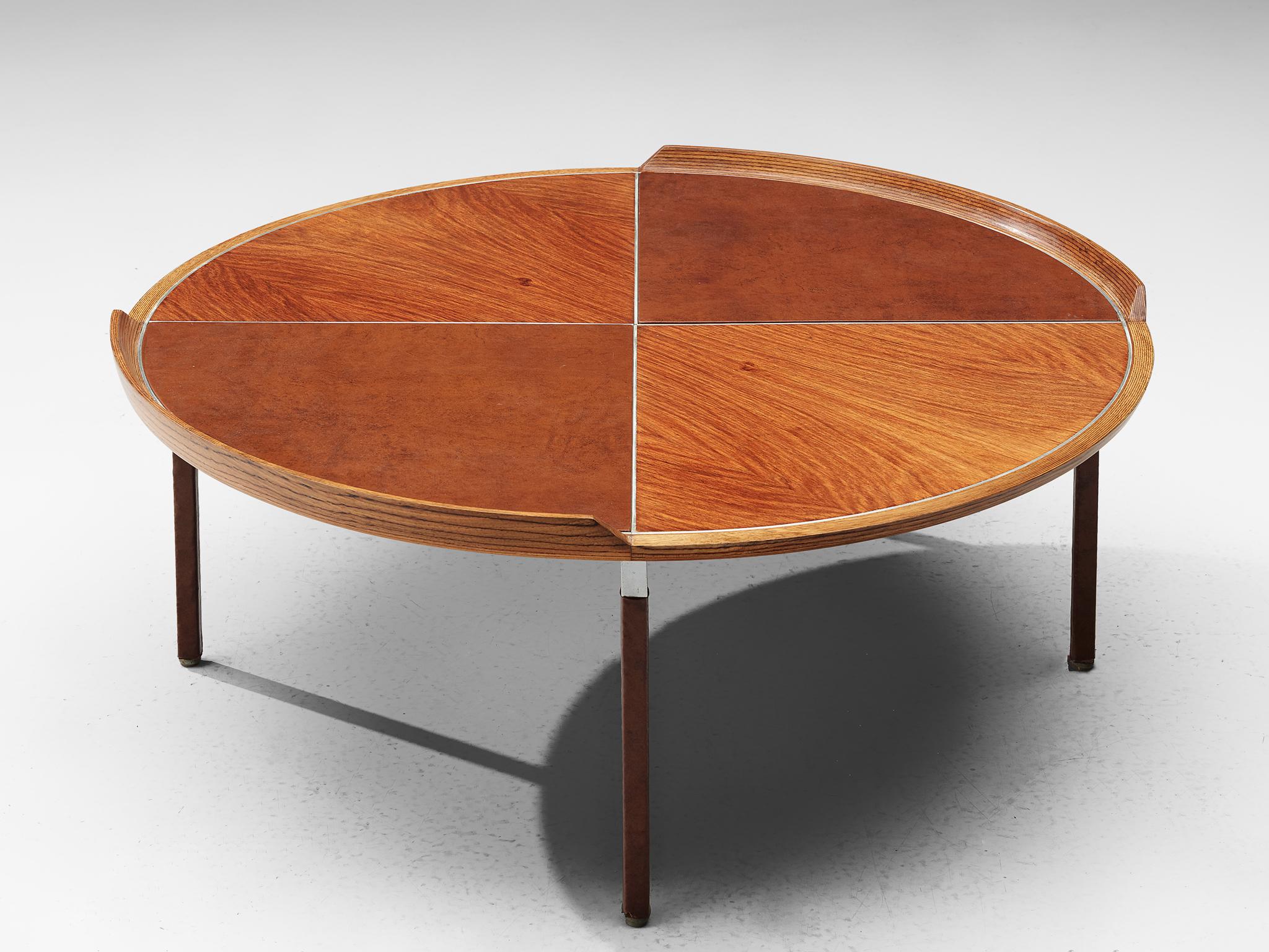 De Coene, rare coffee table made for expo BXL, mahogany and aluminum, Belgium, 1958.

Beautiful round coffee table finished with mahogany veneer and very nice details on the tabletop. The frame where the tabletop lies on is made of aluminum. This