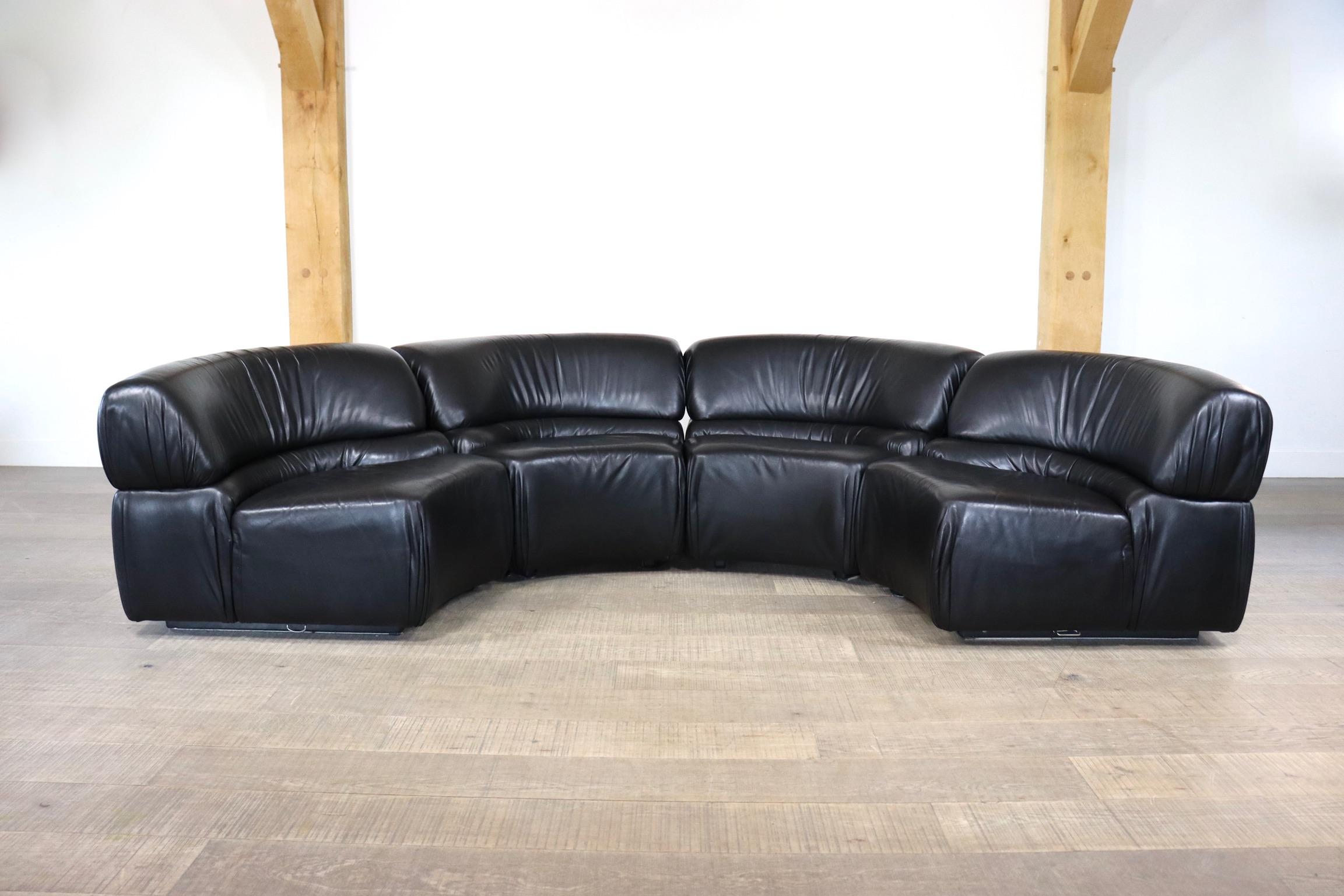 Beautiful and very rare Cosmos sofa designed and manufactured by De Sede, Switzerland 1970s. This sofa has a wooden structure stuffed with foam and covered with stunning black buffalo leather. The elements can be attached to each other with the