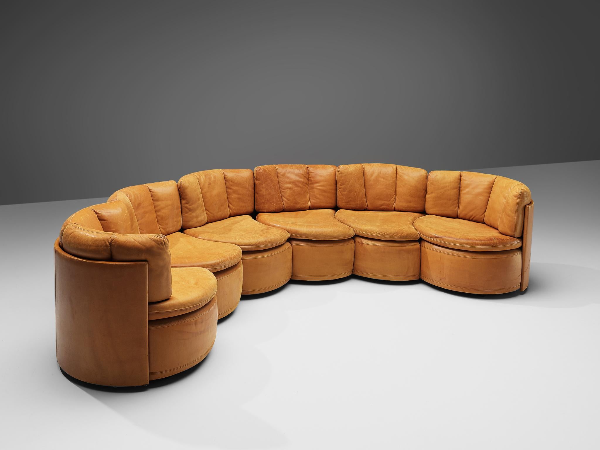 De Sede, sectional sofa model DS-800, cognac leather, Switzerland, 1970s.

This very rare sectional sofa designed by De Sede in the 1970s contains out of two corner elements and four elements without armrests. That makes it possible to arrange