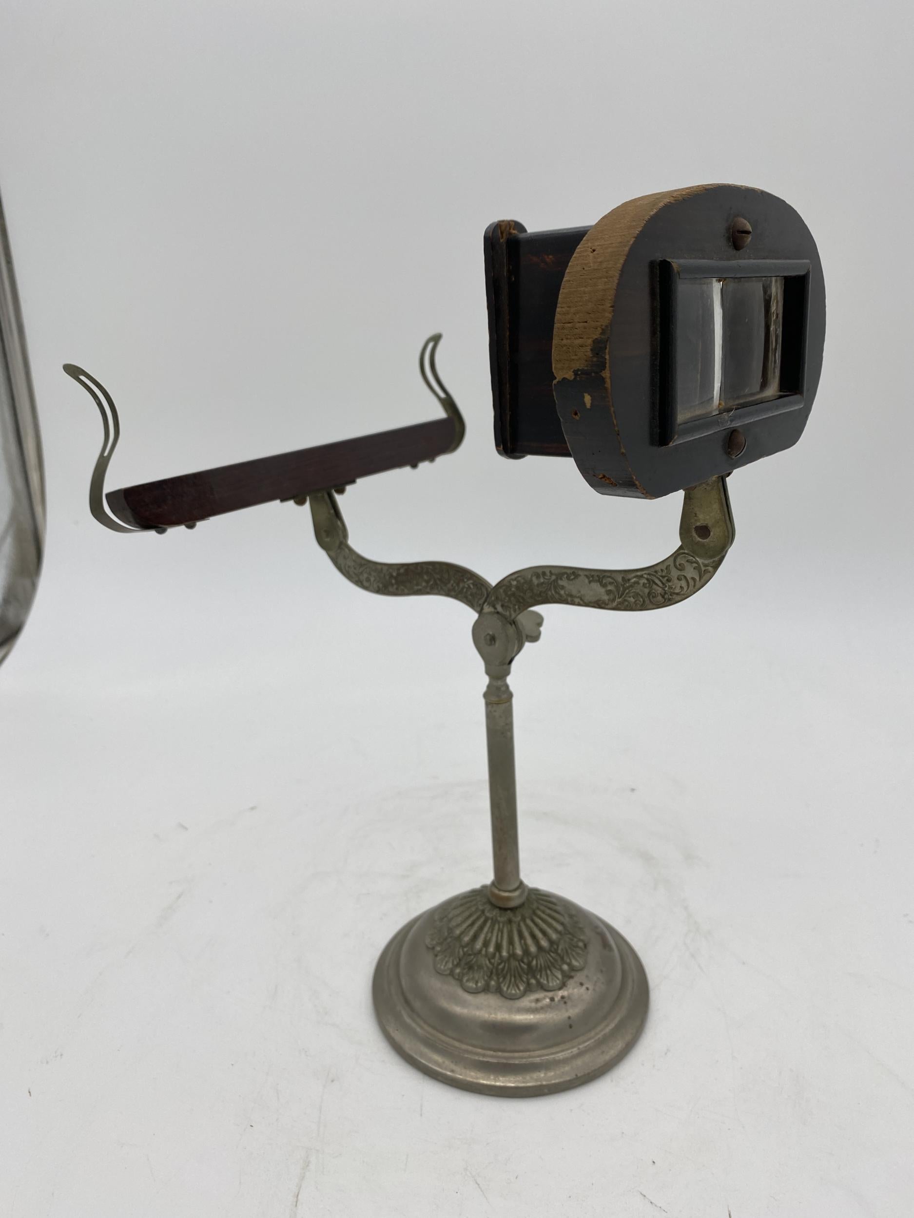 Rare decorative table top Stereo-Graphoscope Stereo Viewer with spelter metal base and wood viewing frame.

Circa 1889.
