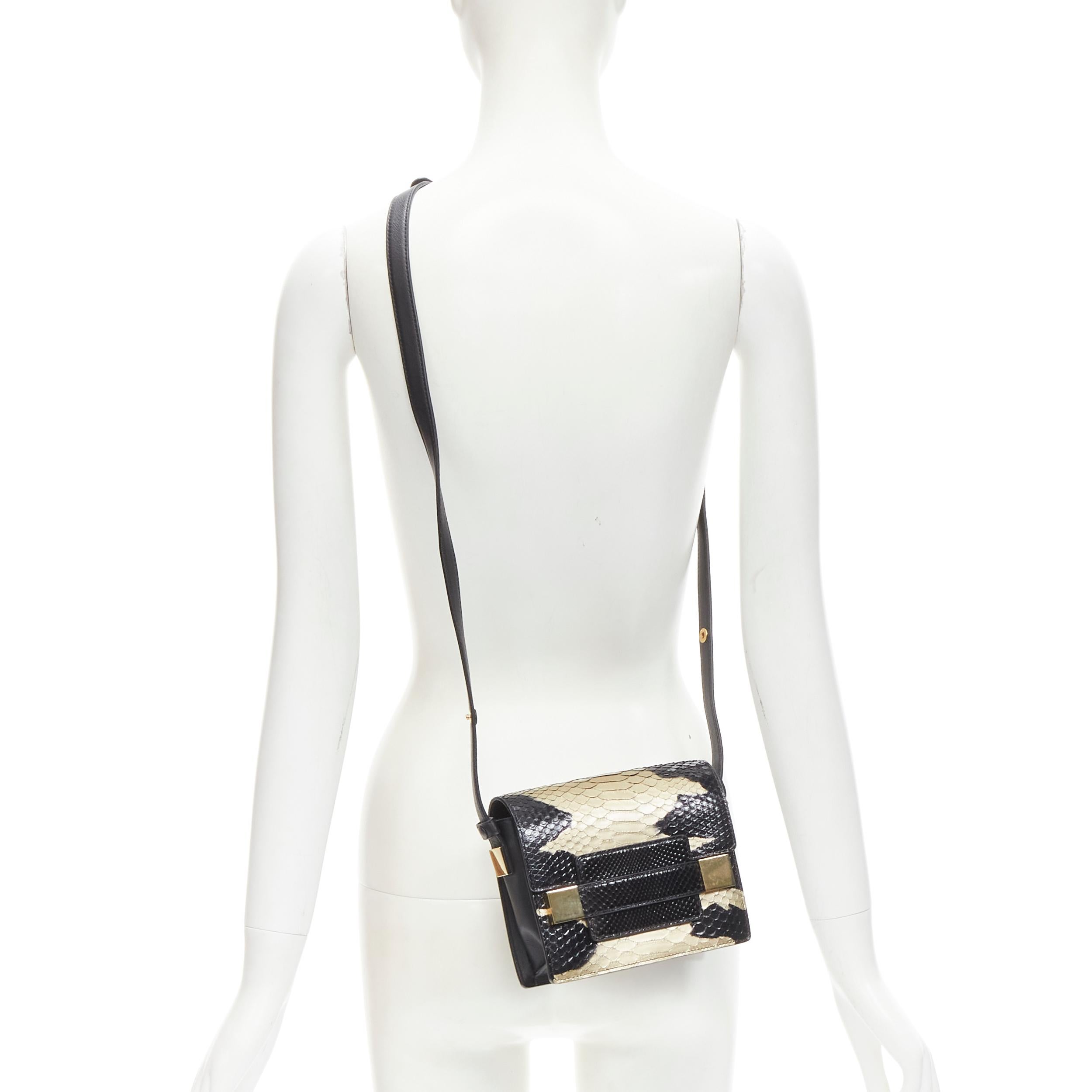 rare DELVAUX Le Madame black gold spray painted scaled leather crossbody box bag
Brand: Delvaux
Model: Le Madame
Material: Leather
Color: Black
Closure: Flap
Extra Detail: Black genuine scaled glossy leather with metallic gold spray painted over it.