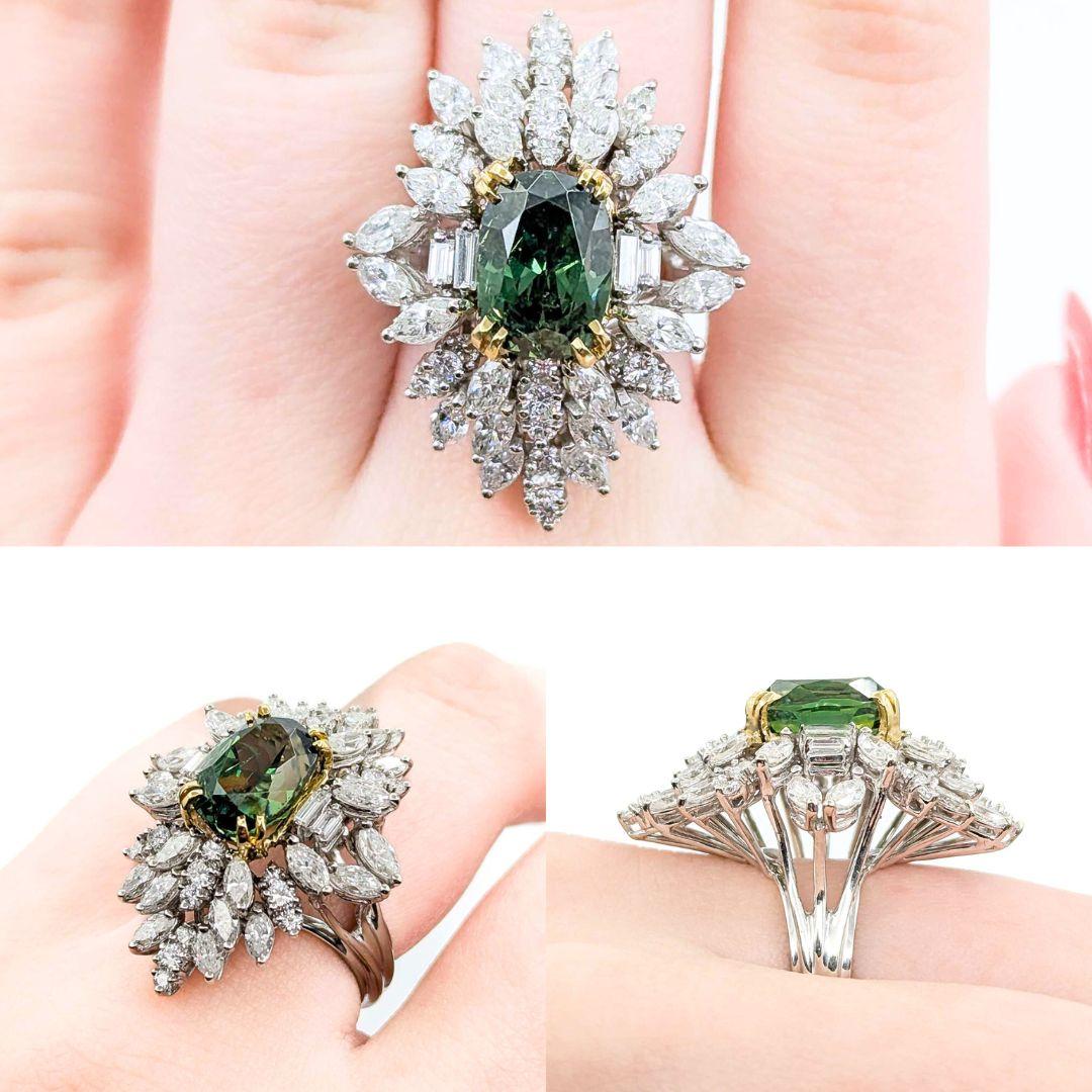 Rare Demantoid Garnet & Diamond Ring in 18k White Gold
Introducing this stunning 18kw Cocktail Garnet Ring, beautifully crafted and adorned with a shimmering 3.82ctw of Diamonds and a 6.13ct Forest Green Demantoid Garnet. The ring comes with a GIA