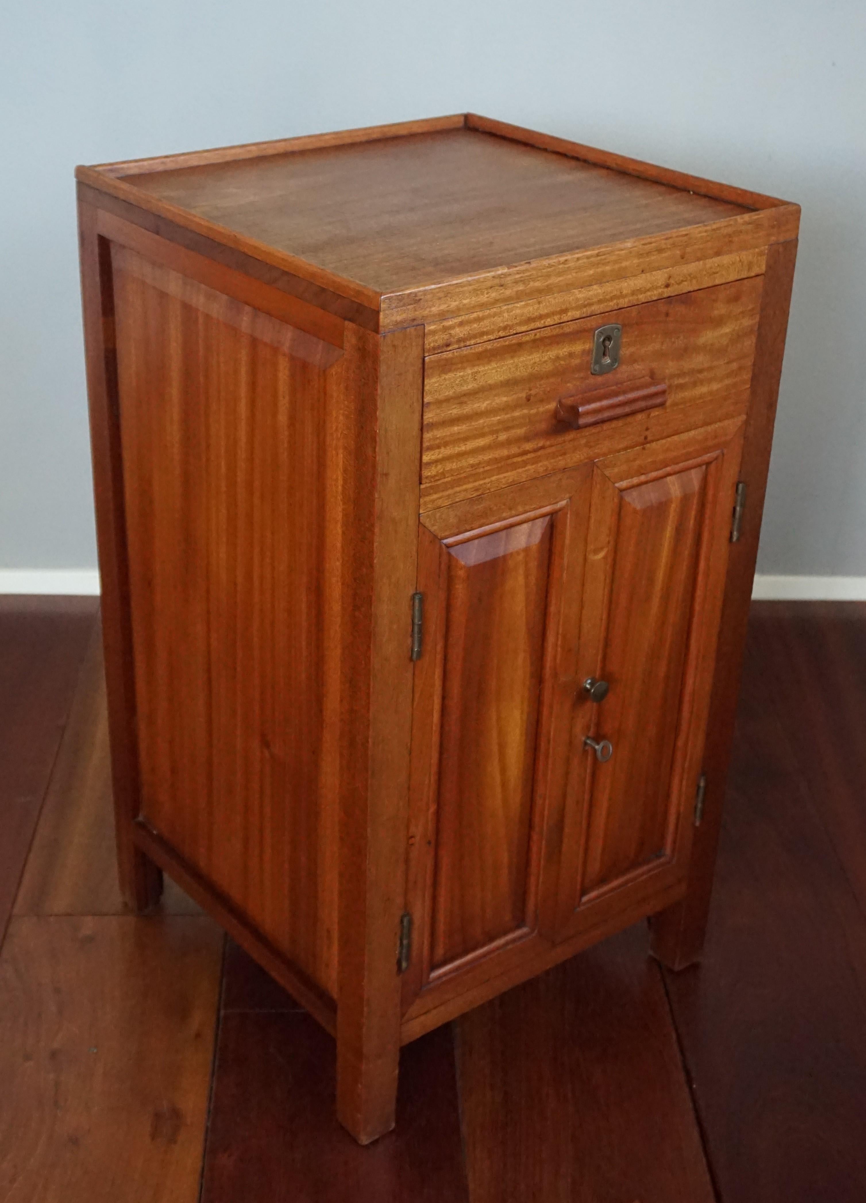 Rare, beautiful color and stylish design cabinet for all kinds of purposes. 

This handcrafted cabinet from the 1920s is beautifully angular in design and it is made of the finest quality and color teakwood. Made of solid teakwood with a marvelous