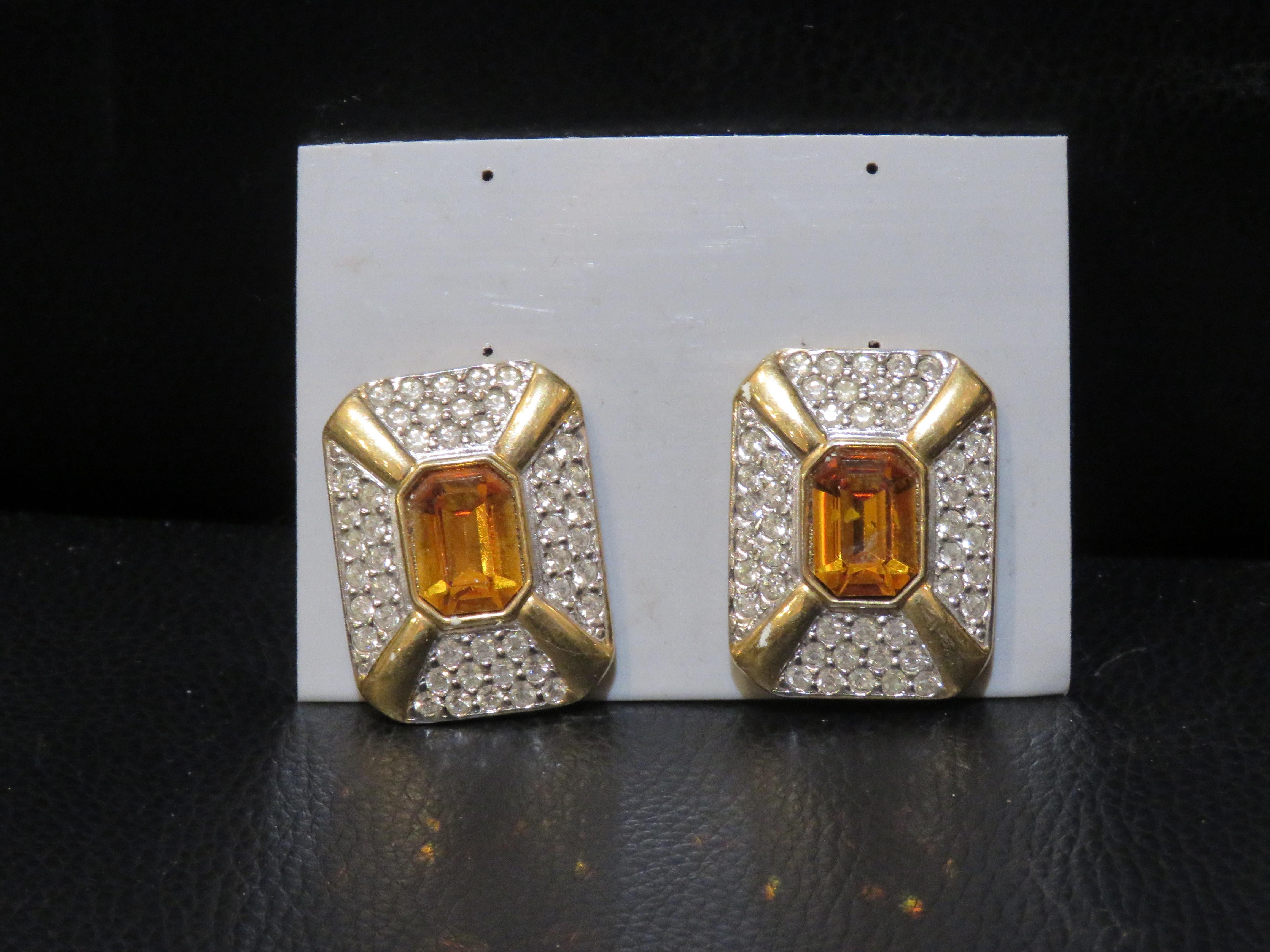 The Following Item we are offering is a Rare Important Estate Radiant 18KT Overlaid Gold Citrine Color Cubic Zirconia Designer Style Earrings. These Gorgeous Earrings are Vintage Large Emerald Shaped Crystal Citrine surrounded with Cubic Zirconia