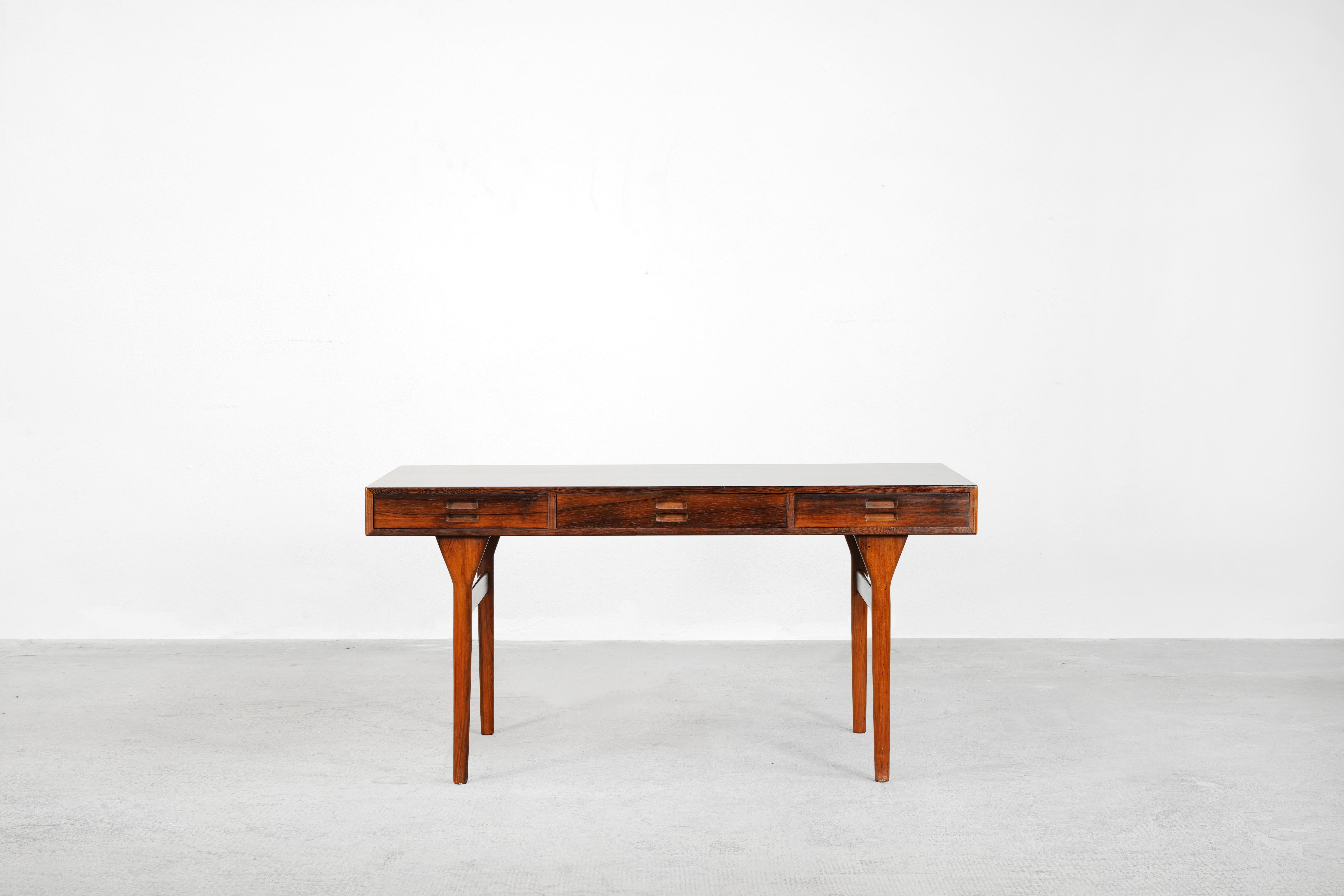 Very beautiful desk designed by Nanna Ditzel for Søren Willadsen Møbelfabrik, made in Denmark in 1955. 
The desk is in very good condition and is ready for usage.

 