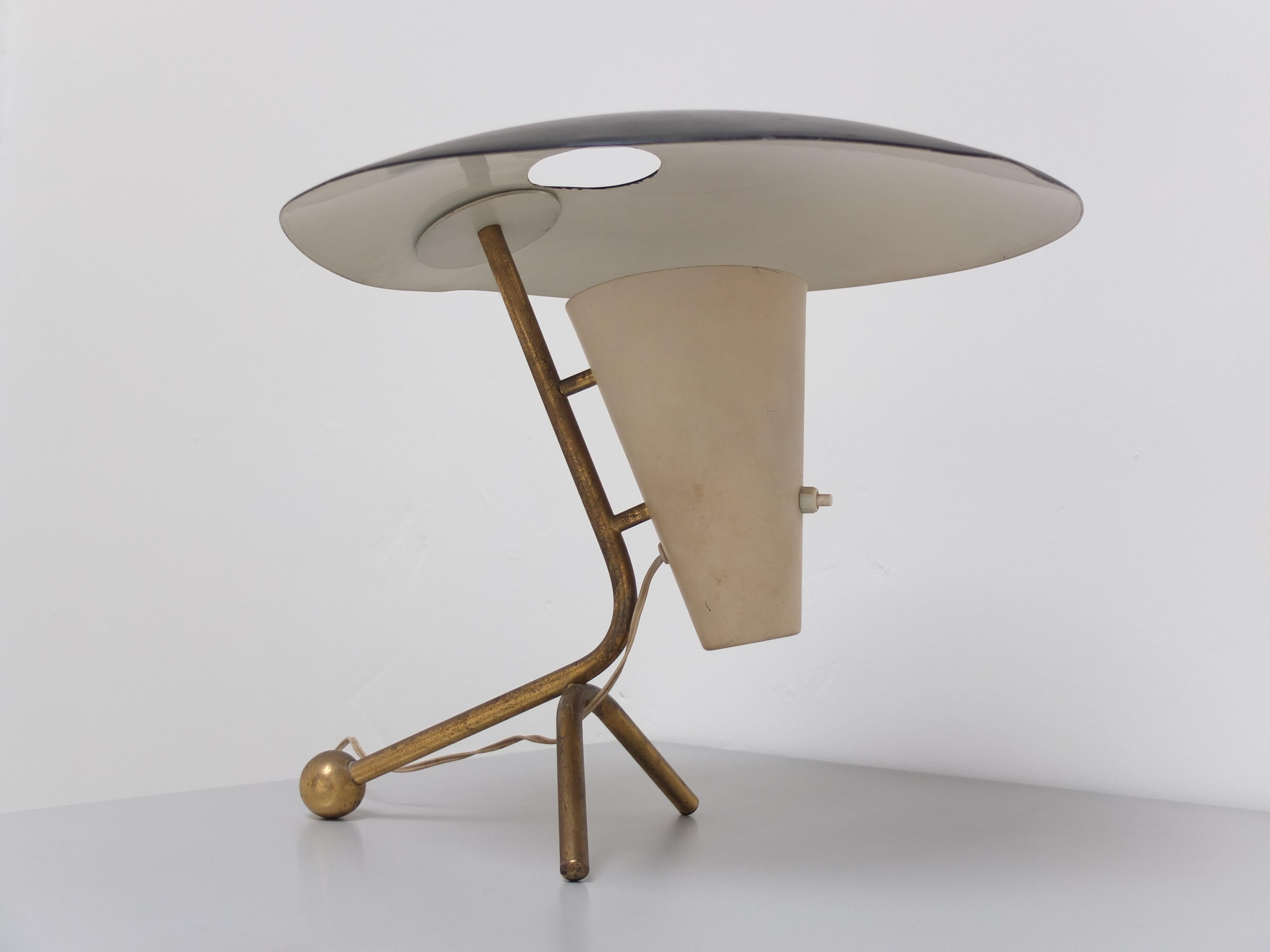 An exceptional desk lamp probably designed by Pierre Guariche for Disderot in 1952. Probably because it resembles a documented model very well but it is not 100% the same. So this could also be a prototype or one-off version. Either way a very