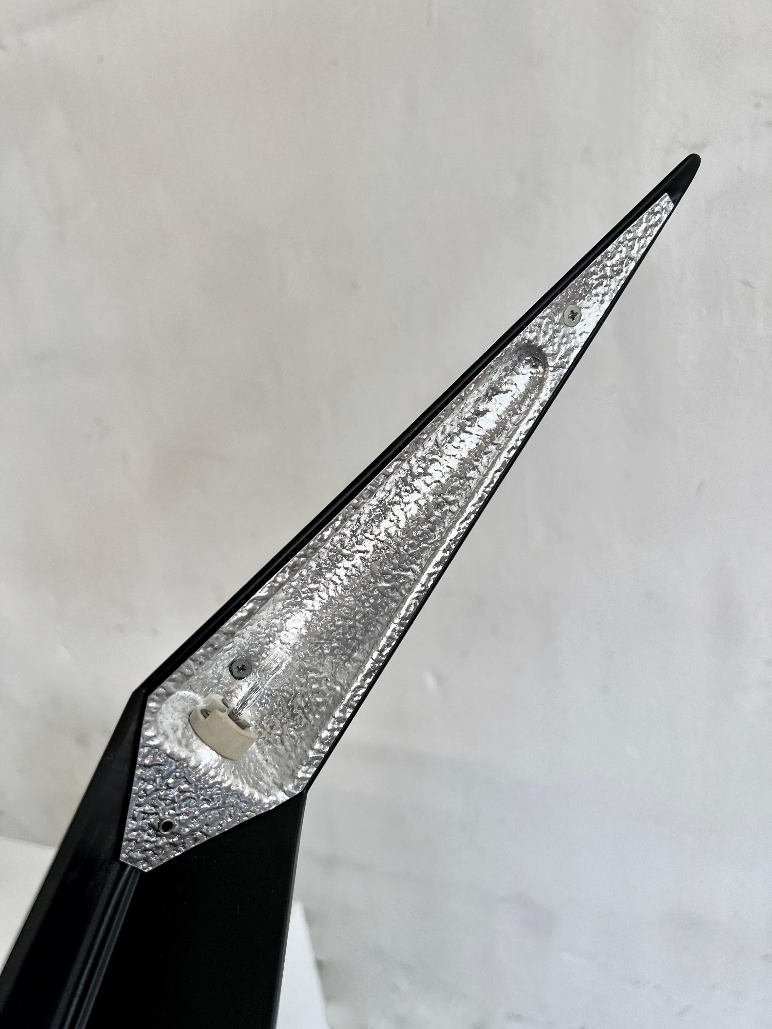 Here we have a sublime design clearly based on the Concorde airplane, hence its name. Designed by Yves Christin and produced by Antonangeli Illuminazione, Italy.
 
In the sixties the exploration of the universe lead to the first attempt to travel to